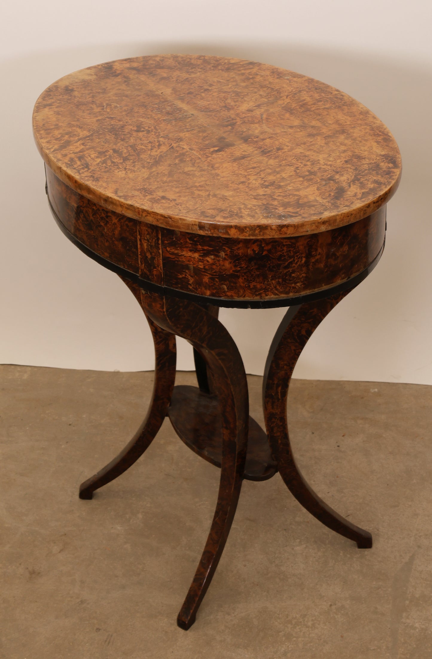 An 1800s antique table slightly from above and back.