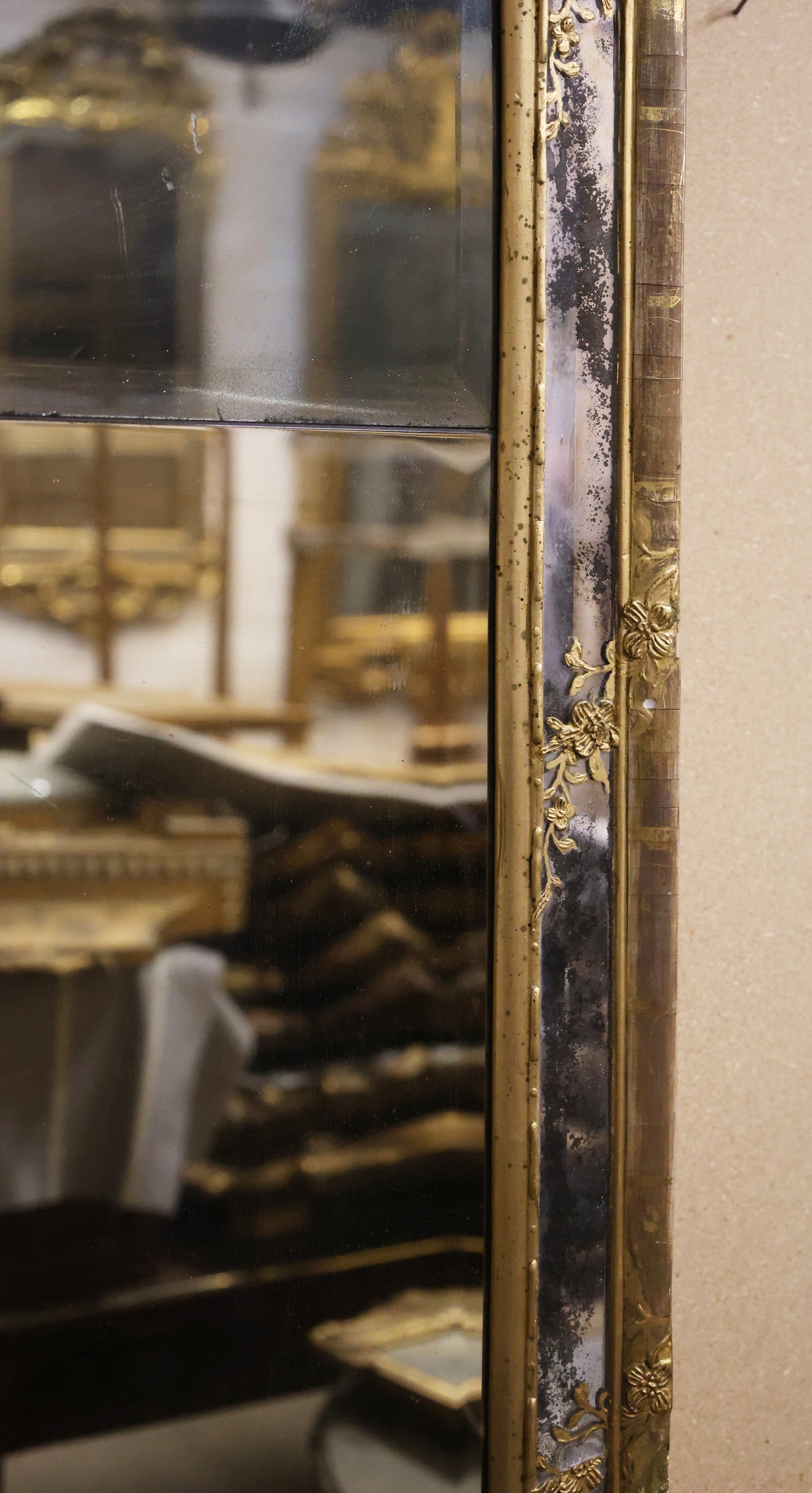 Close up of details on a gilded 18th century rococo mirror.