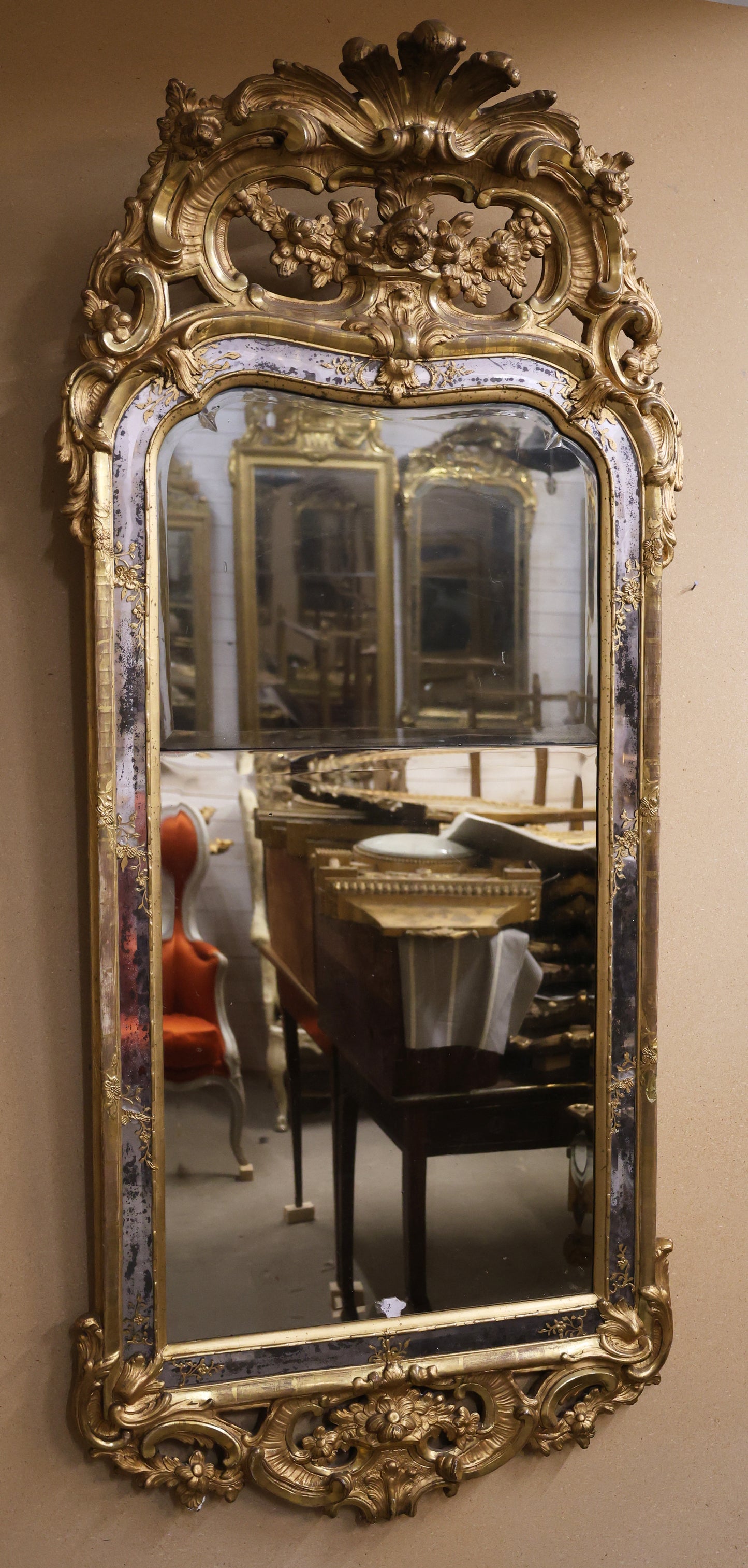 A gilded 18th century rococo mirror for sale