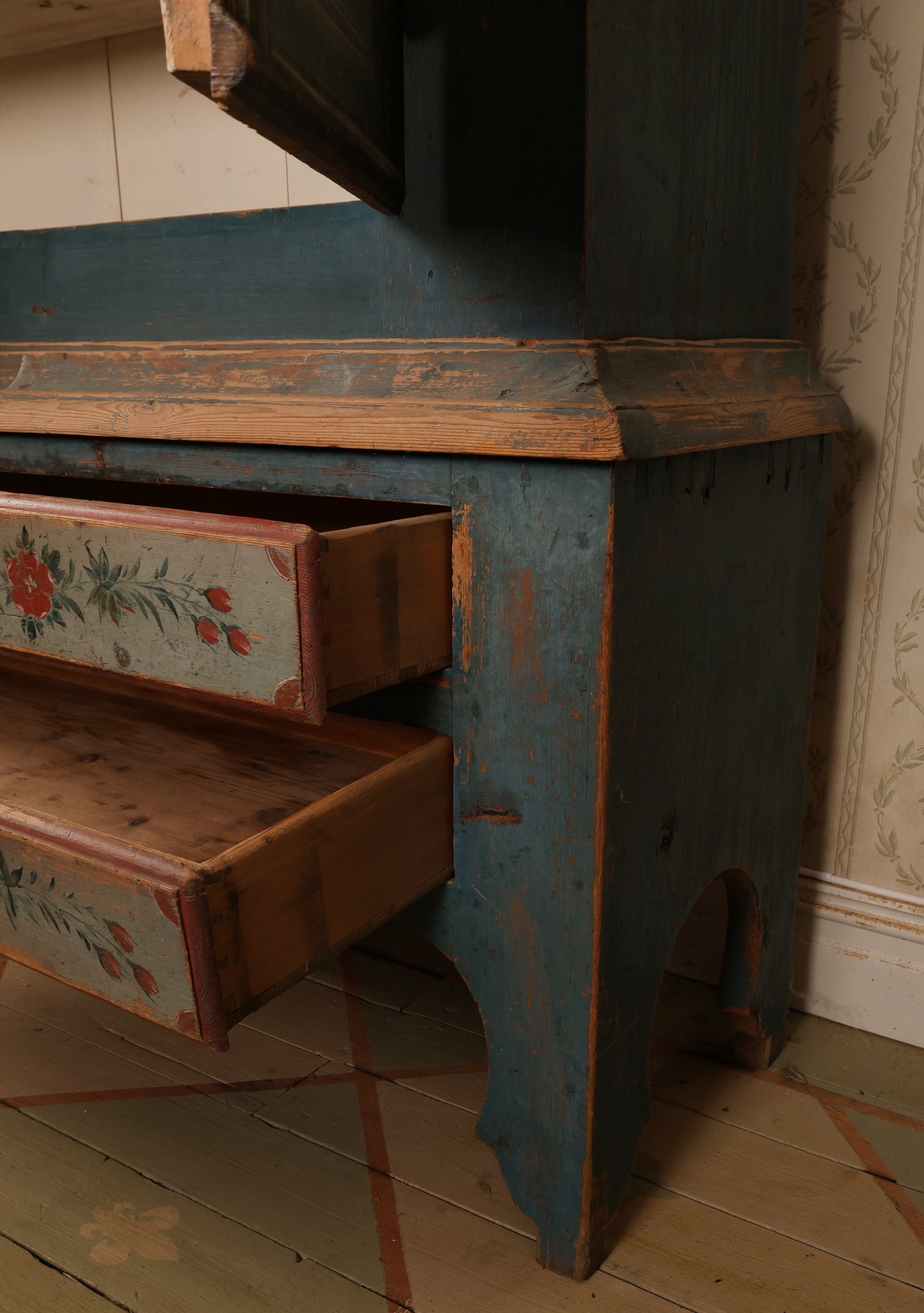 Close up of an 19th century blue cabinet.