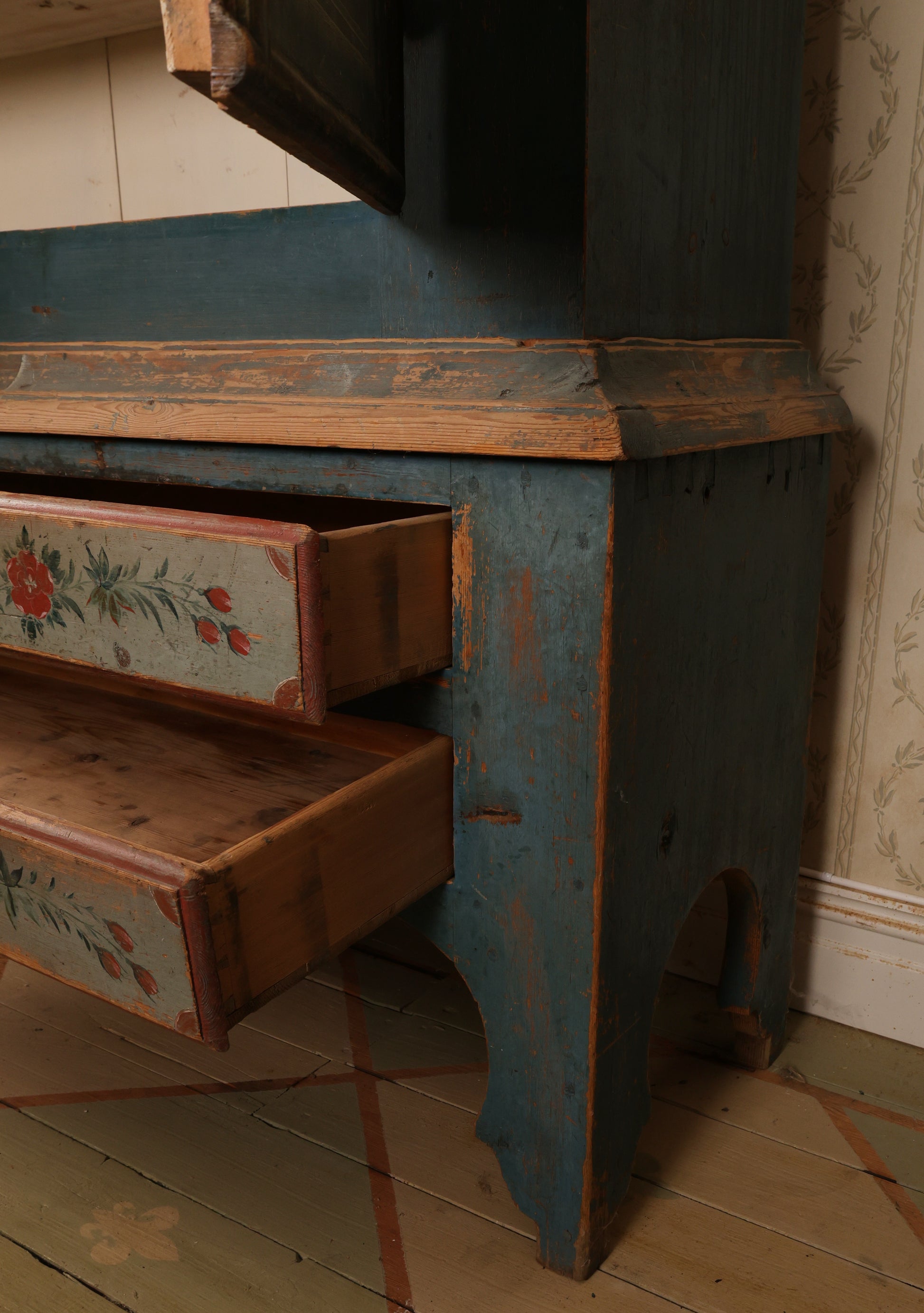 Close up of an 19th century blue cabinet.