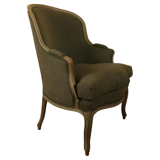 A high-class and unusually large Rococo bergere chair with green fabric from the 18th century with white background