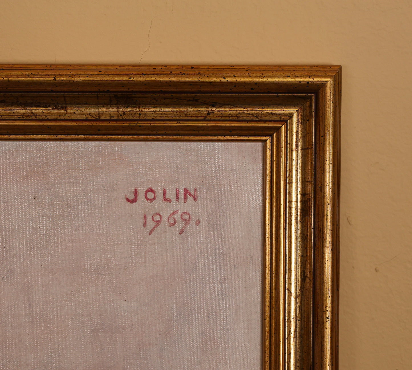 The signature on the back of a painting by Einar Jolin.