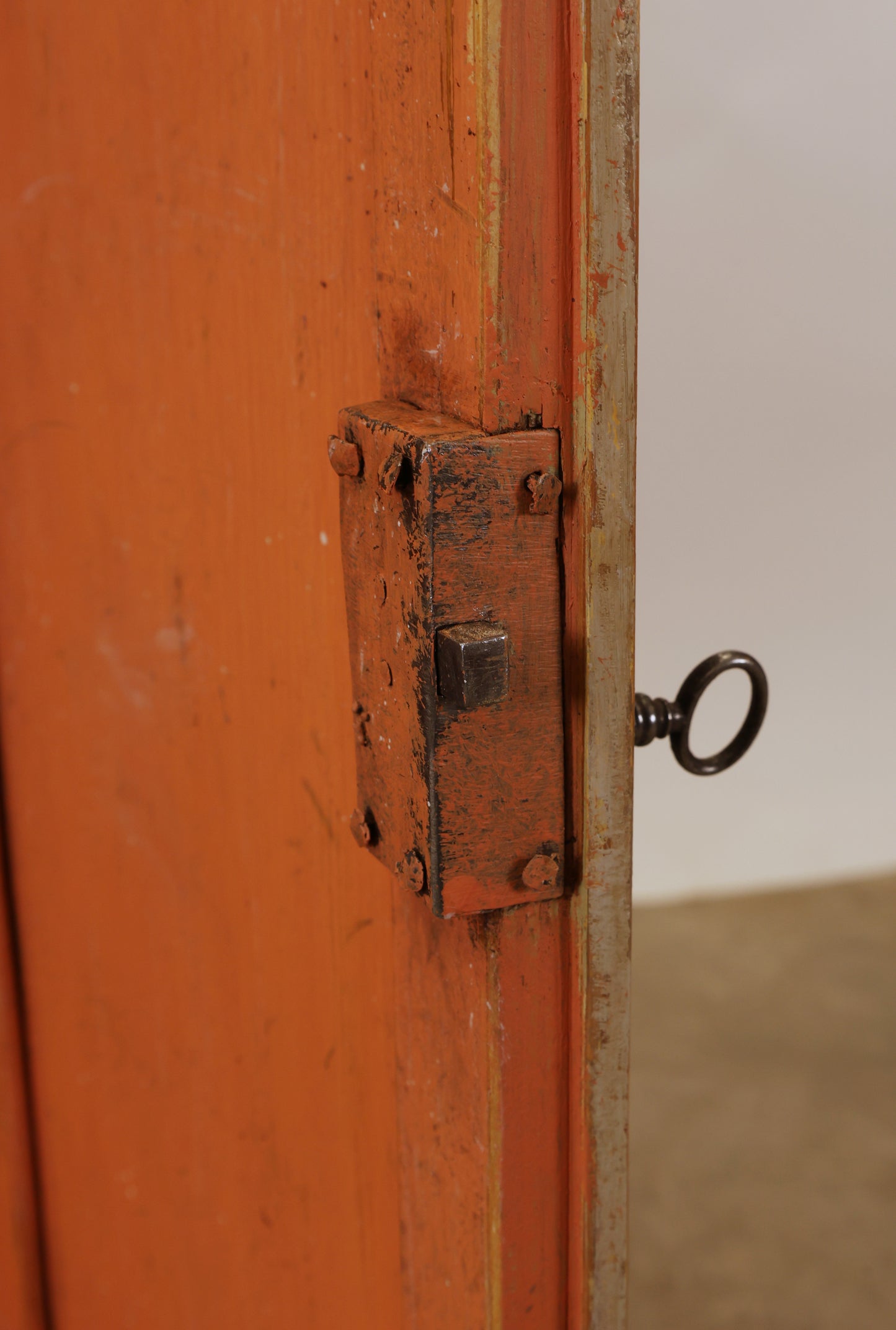 The lock mechanism of an antique Rococo corner cabinet.