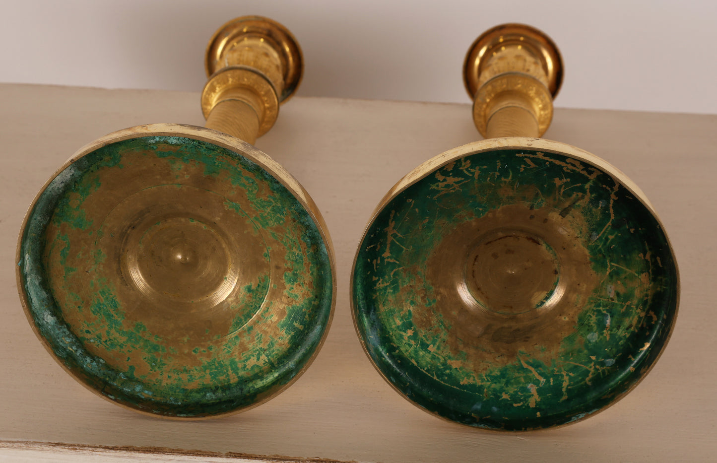 Pair of Empire Candlesticks underneath