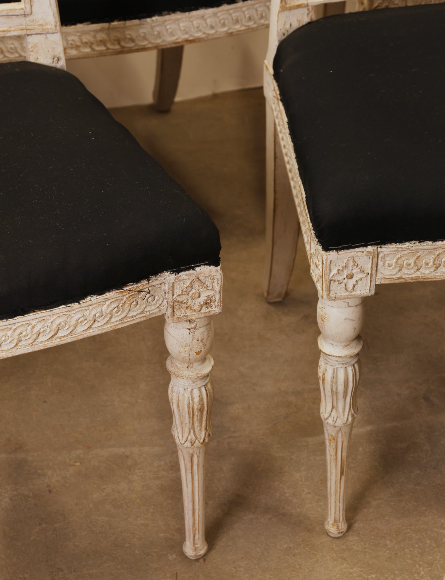 Carved details on antique Gustavian chairs.
