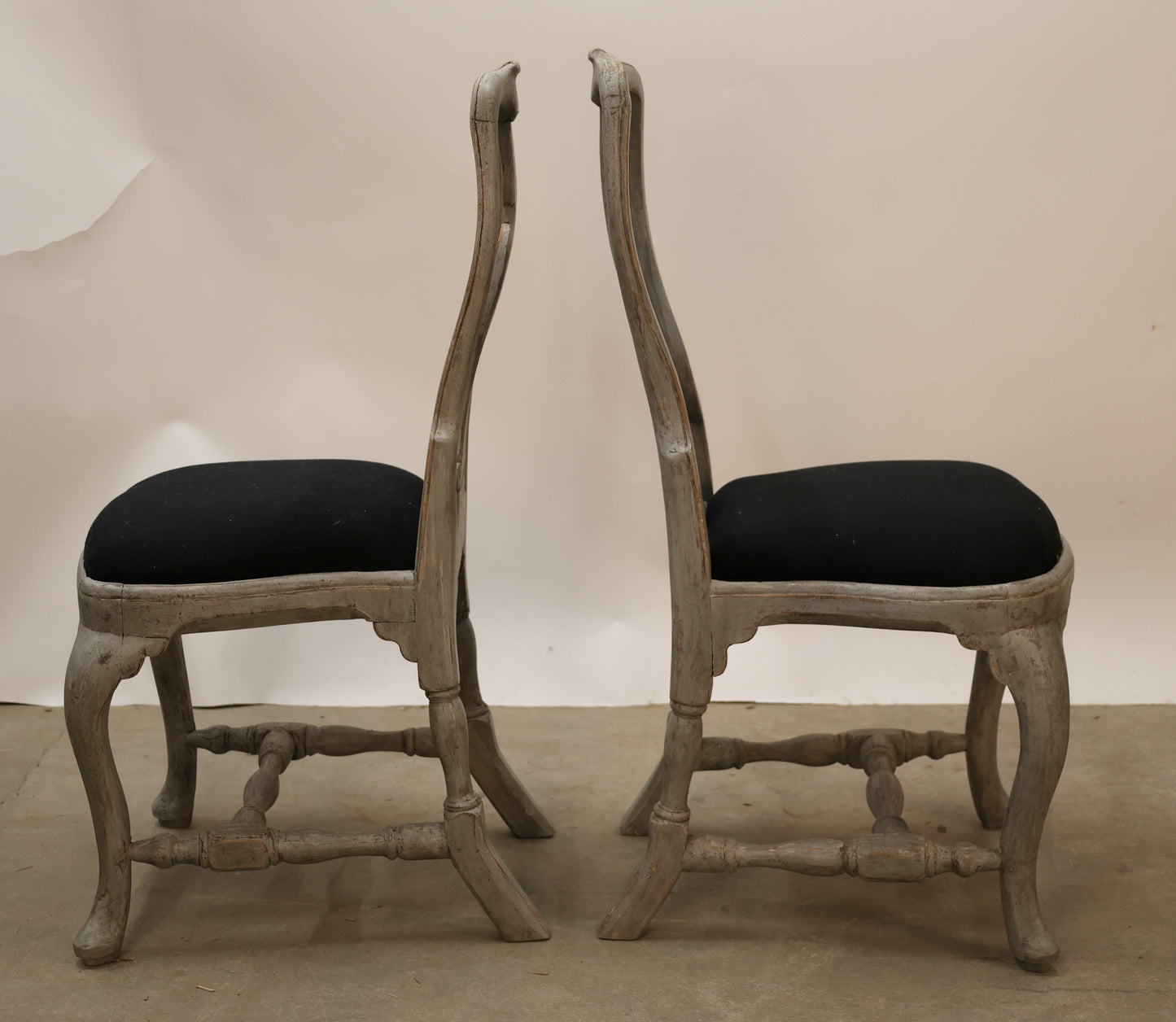 Two antique Rococo chairs as part of a set of eight.