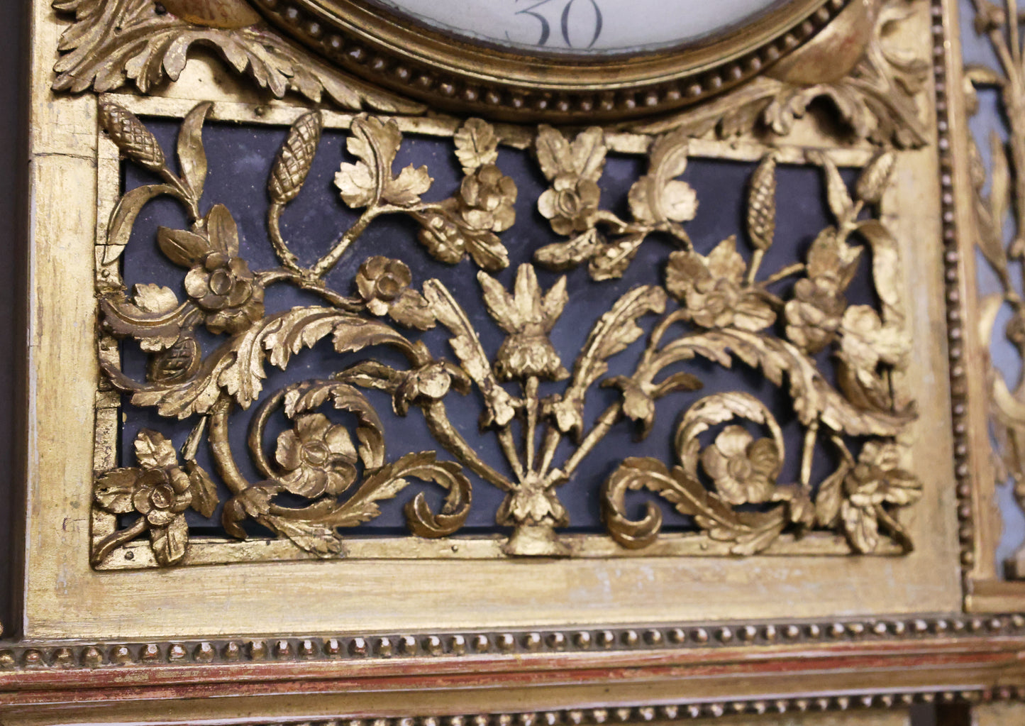 Detail overview of an antique wall clock from the Gustavian epoch.