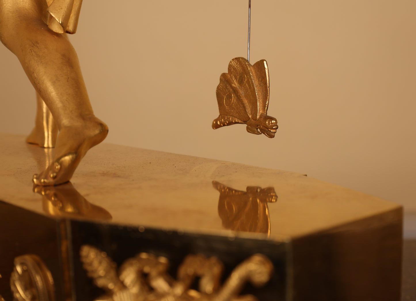 Detail photo of an antique decorative clock.