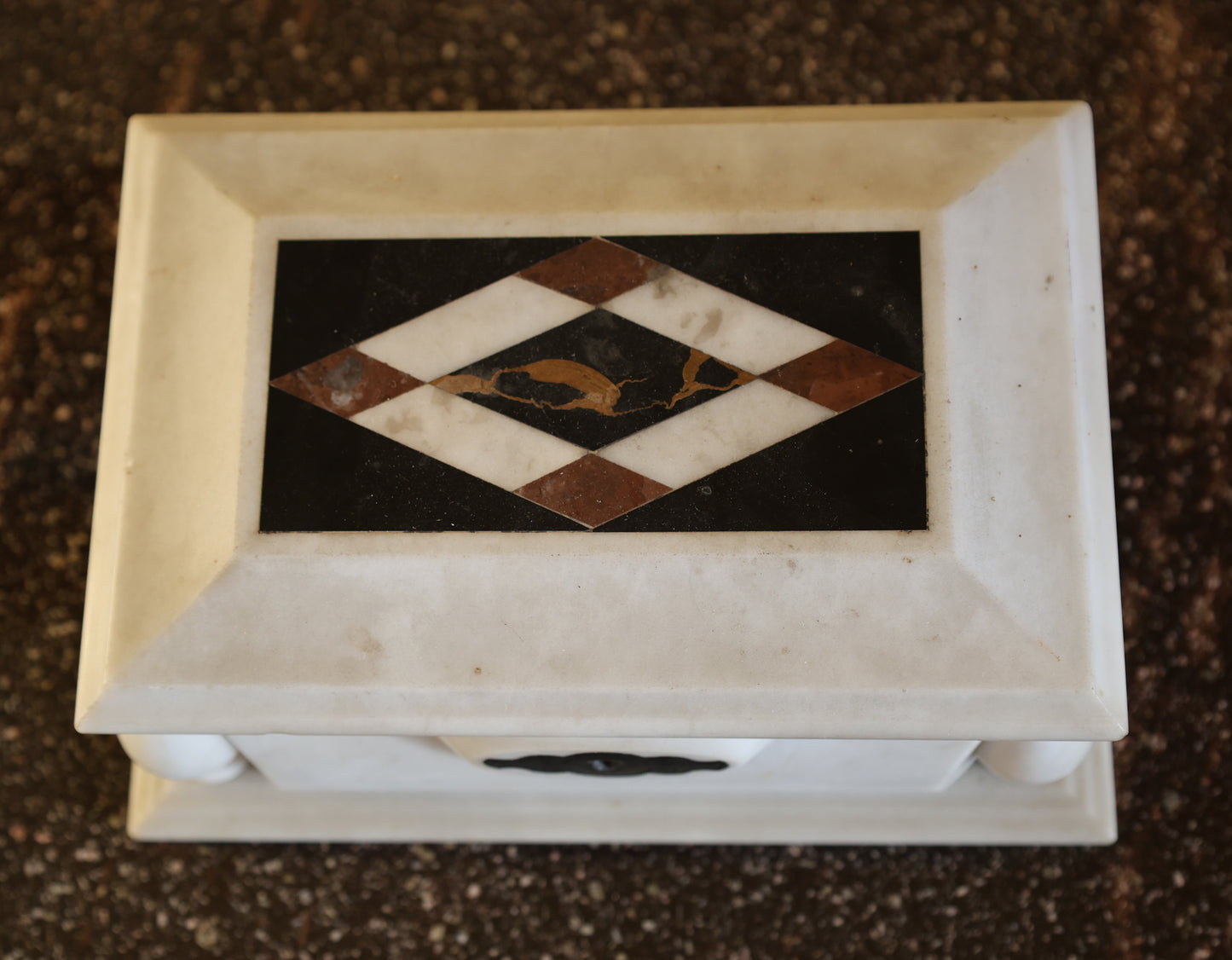 Above view of an antique lidded box in marble for storage