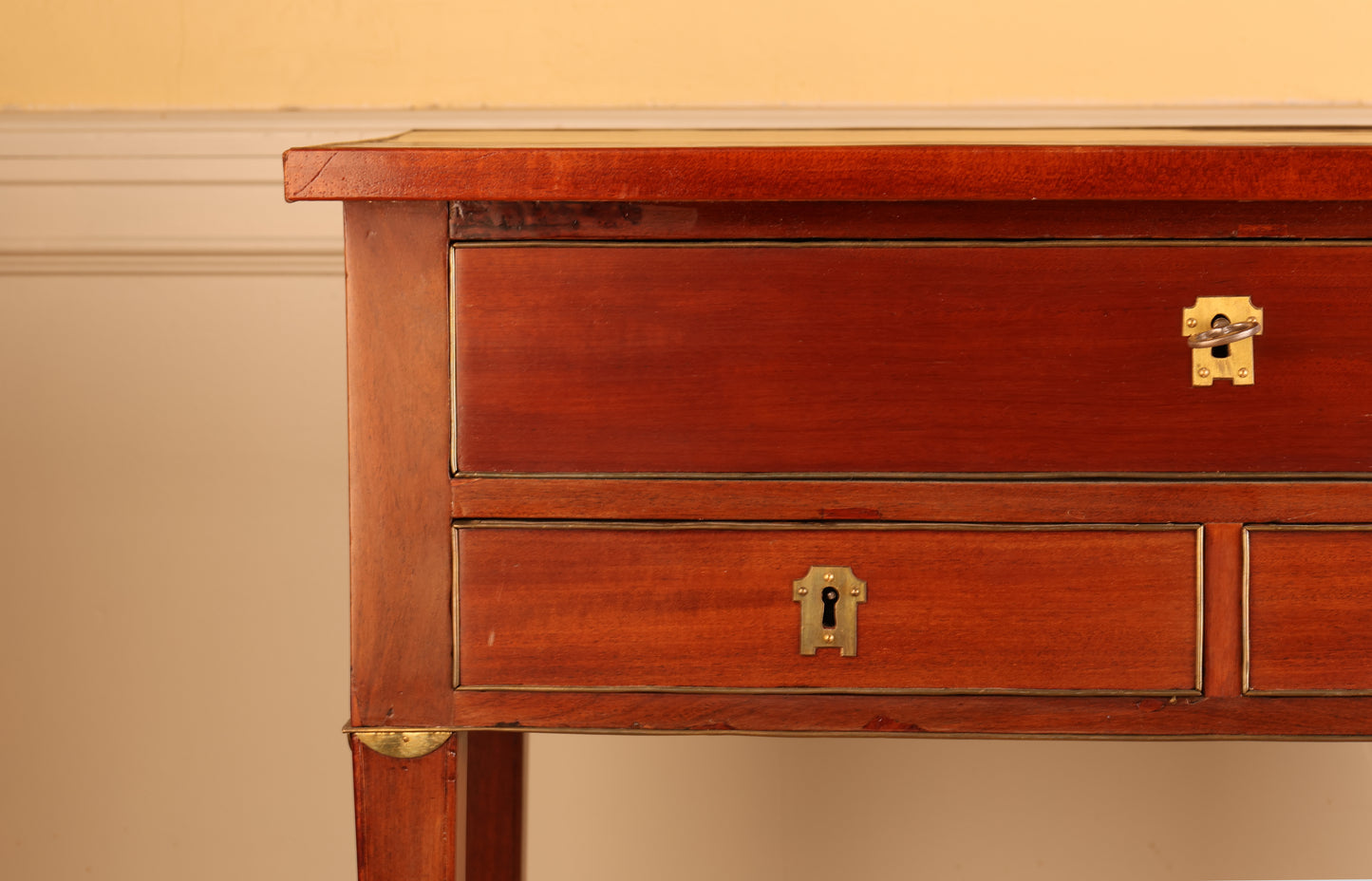 Close up of a Gustavian mahogany table.