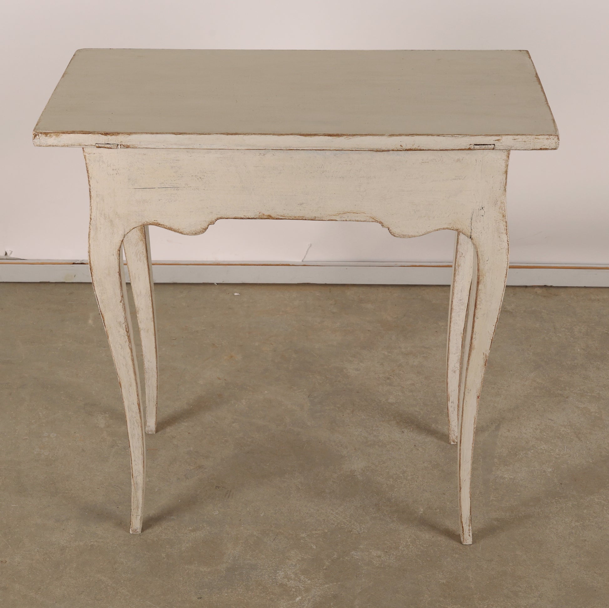 The back of an 18th Century Rococo Table in grey color