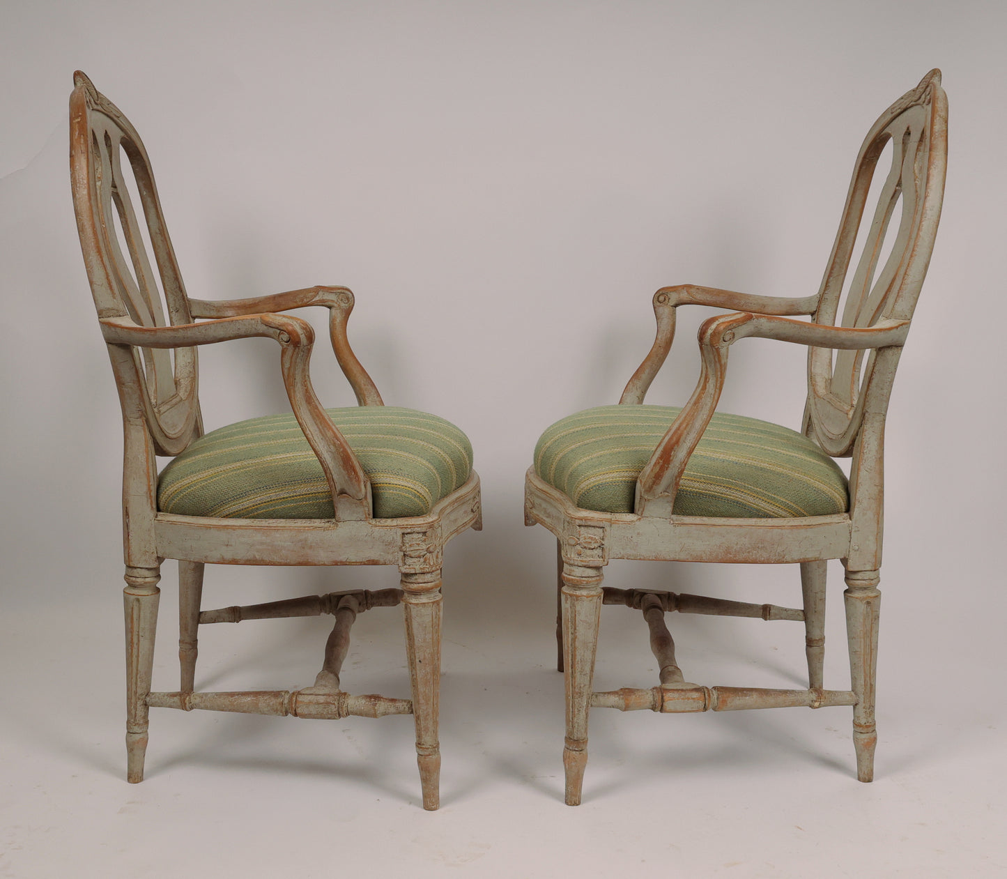 Side view, two chairs facing each other. Titled "18th Century Gustavian Armchairs signed Johan Eric Höglander".