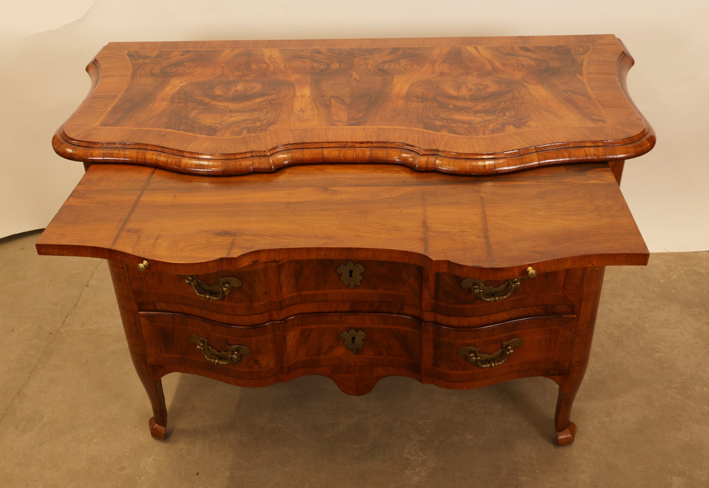The pull-out surface on a Baroque commode.