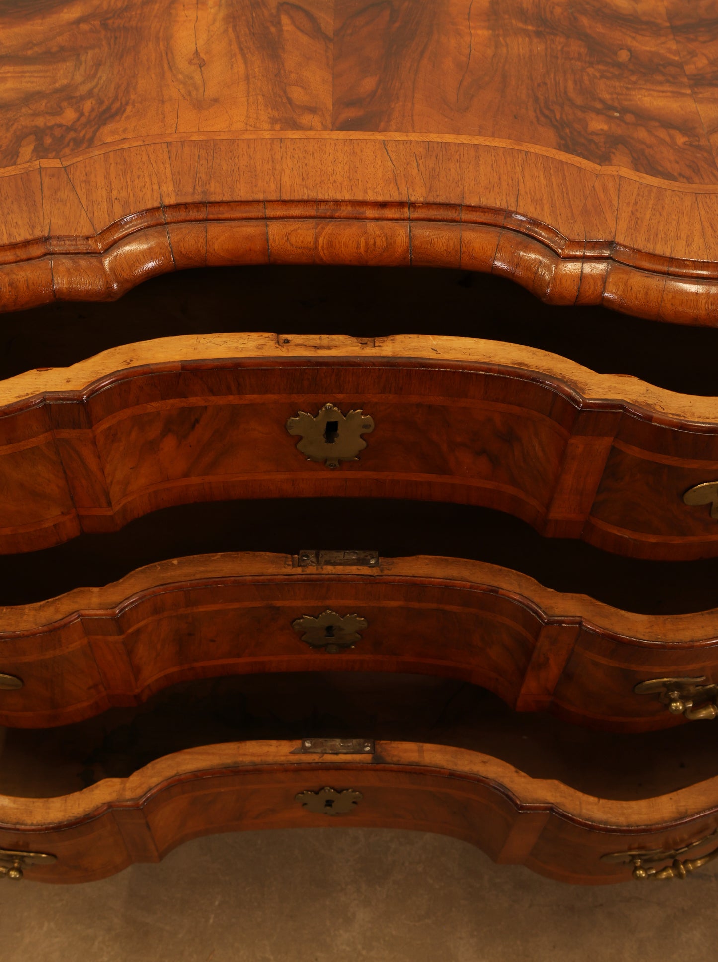 The drawers of a baroque antique dresser.