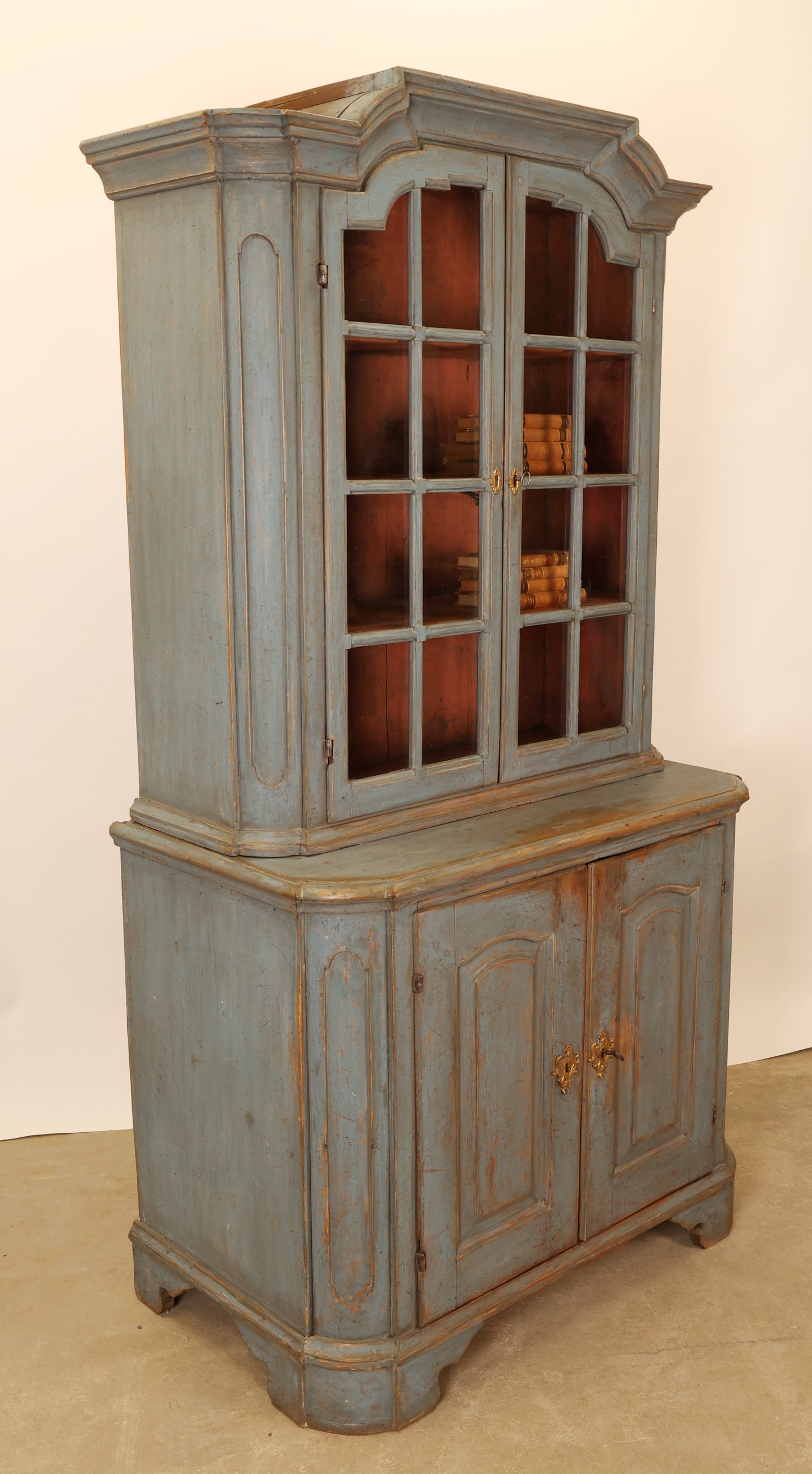 A blue Rococo vitrine cabinet.