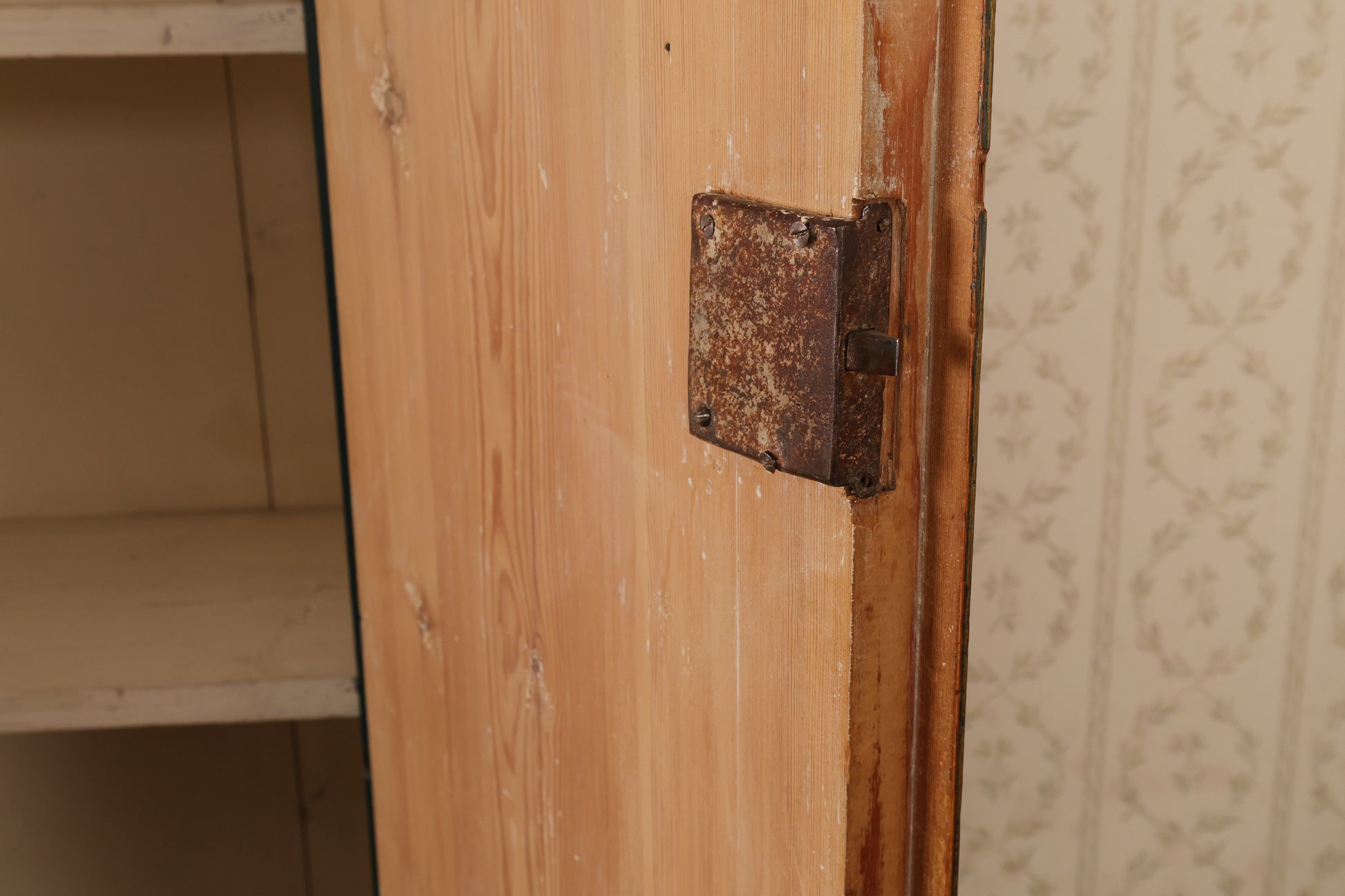 Door mechanism on an early 19th Century Cabinet