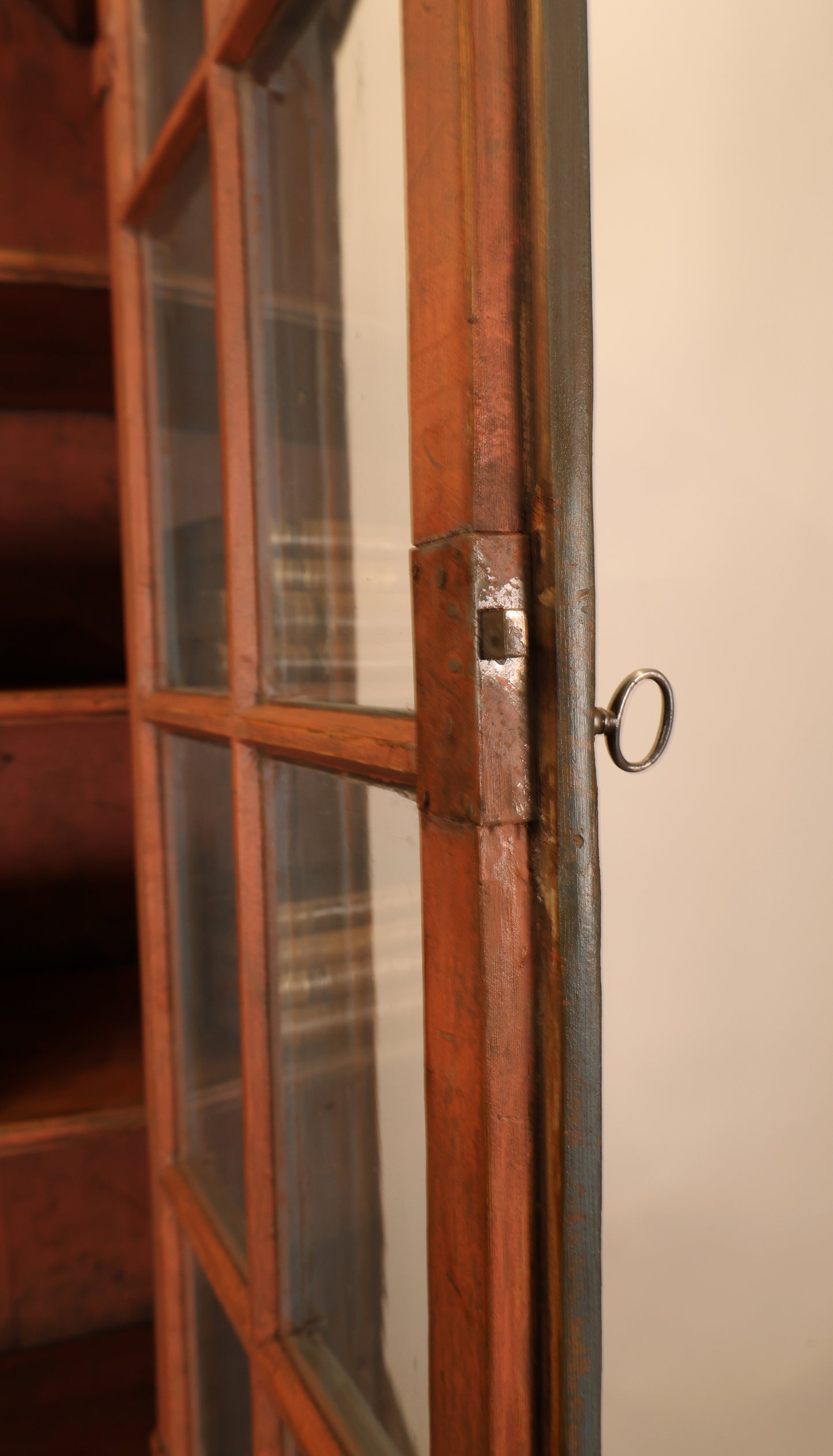 Opened door on a Rococo display cabinet.