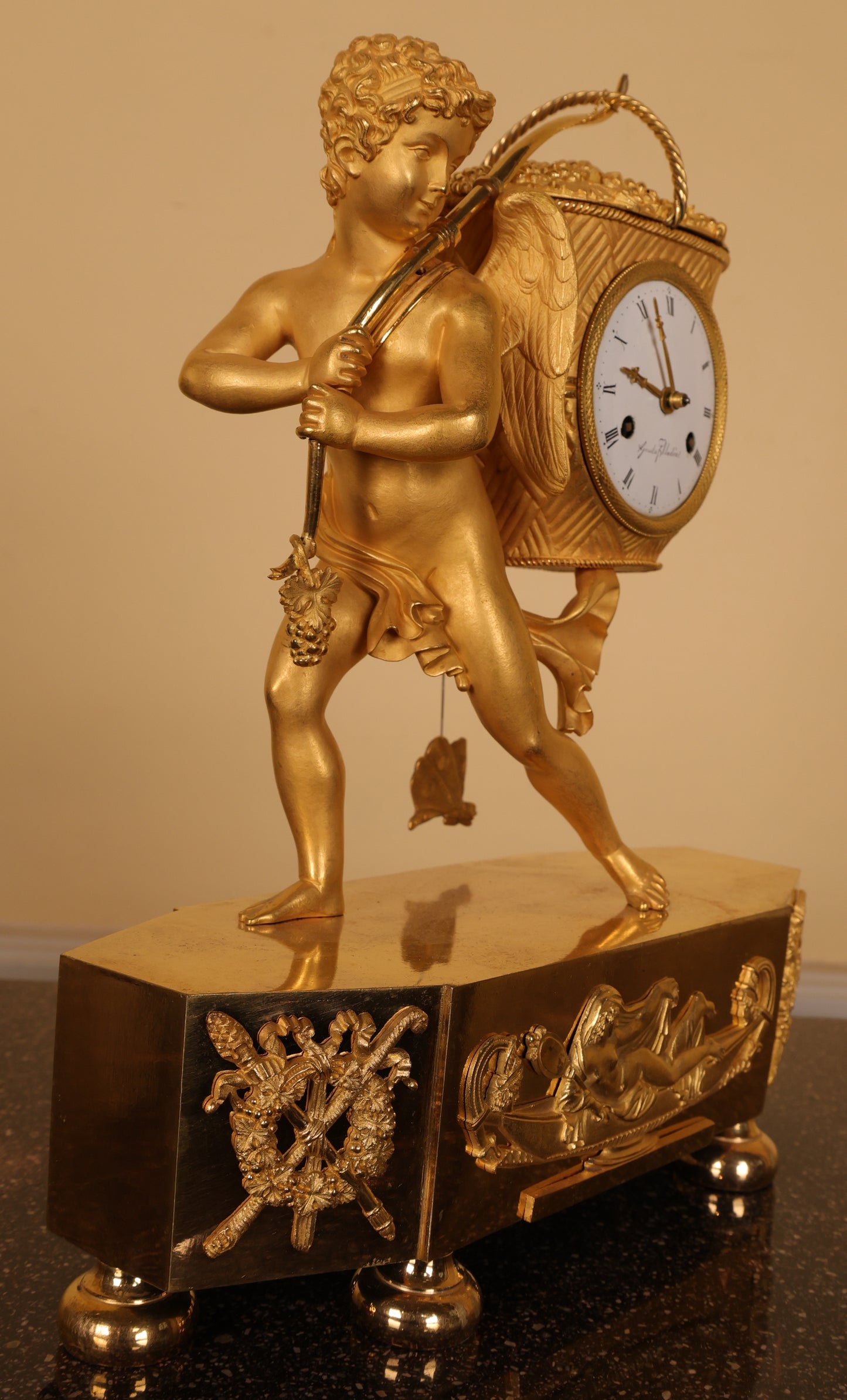 A gustavian clock in fire-gilded bronze.