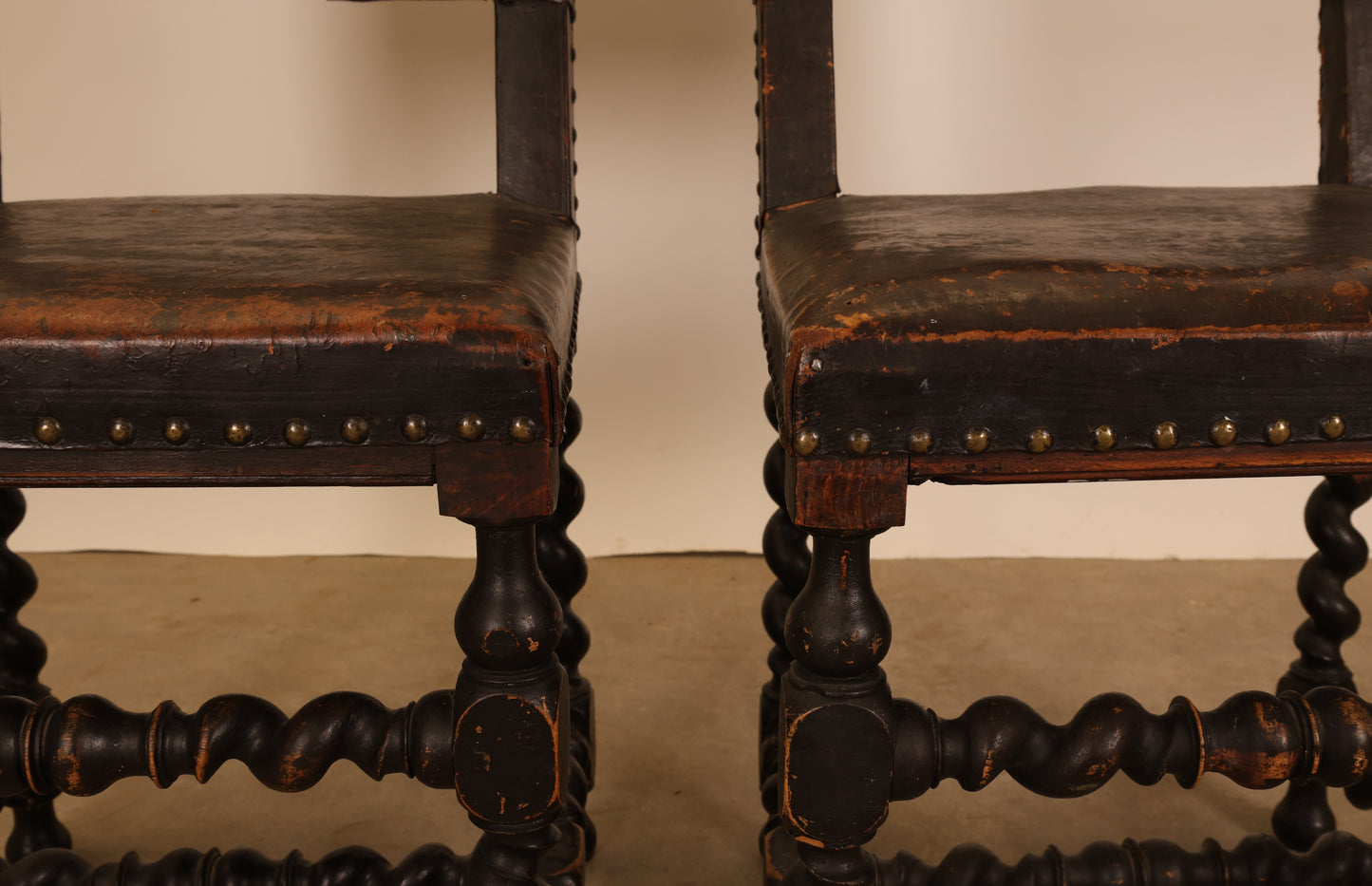 Close up of a pair of Baroque chairs.