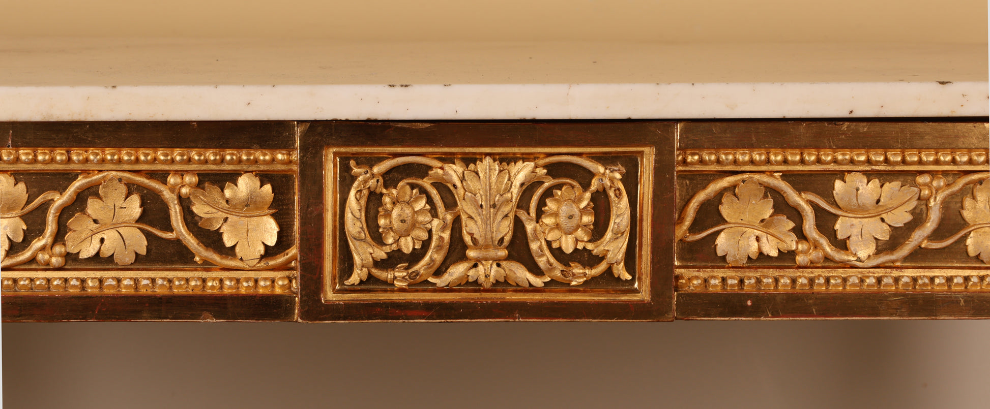 Close up of gold leaf relief detail on an 18th Century Gustavian Console Table