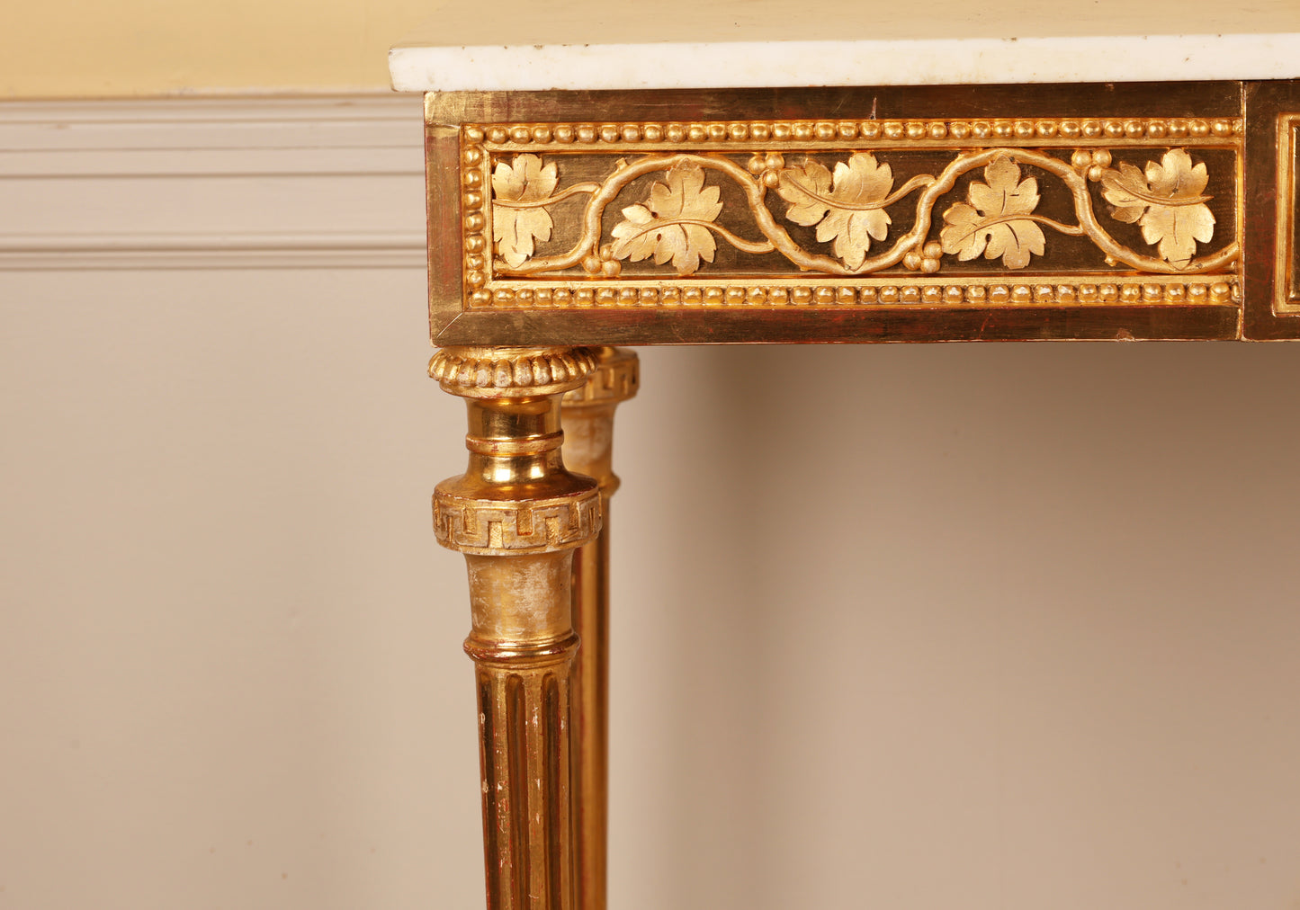 Close up of gold leaf relief detail on an 18th Century Gustavian Console Table