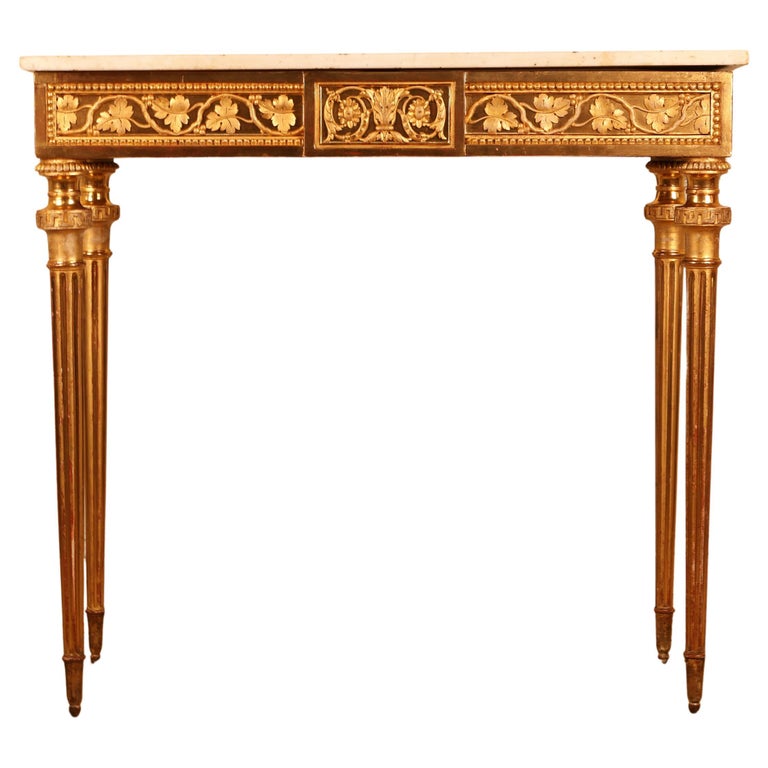 A gustavian console table in gold-leaf.