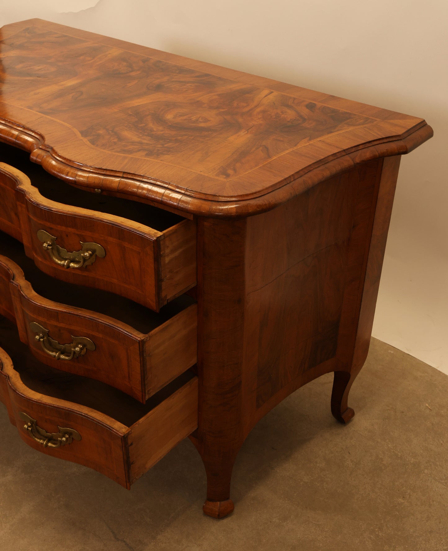 The drawers on a baroque commode.