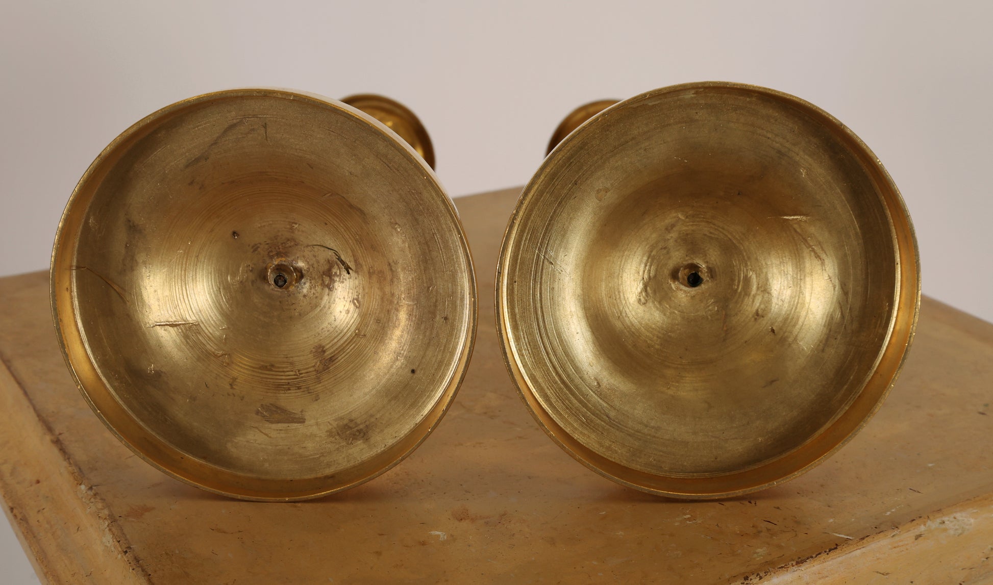 Underneath a pair of empire candleholders