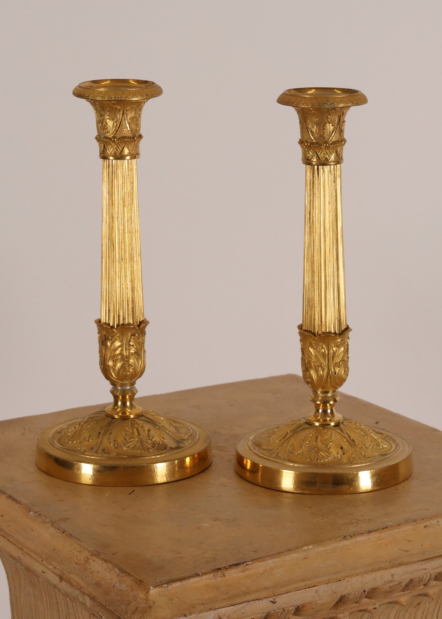 A pair of antique empire candleholders in burnished-gilded bronze for sale on Napoleon Antique & Art.
