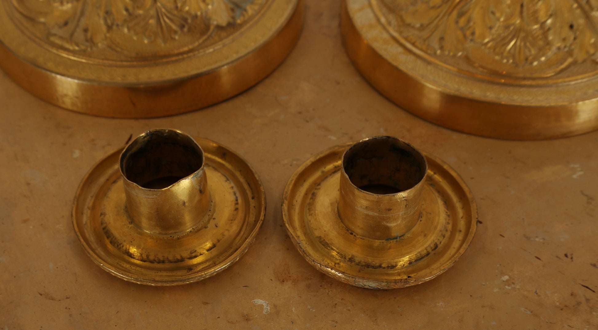 Detached parts of a pair of empire candleholders