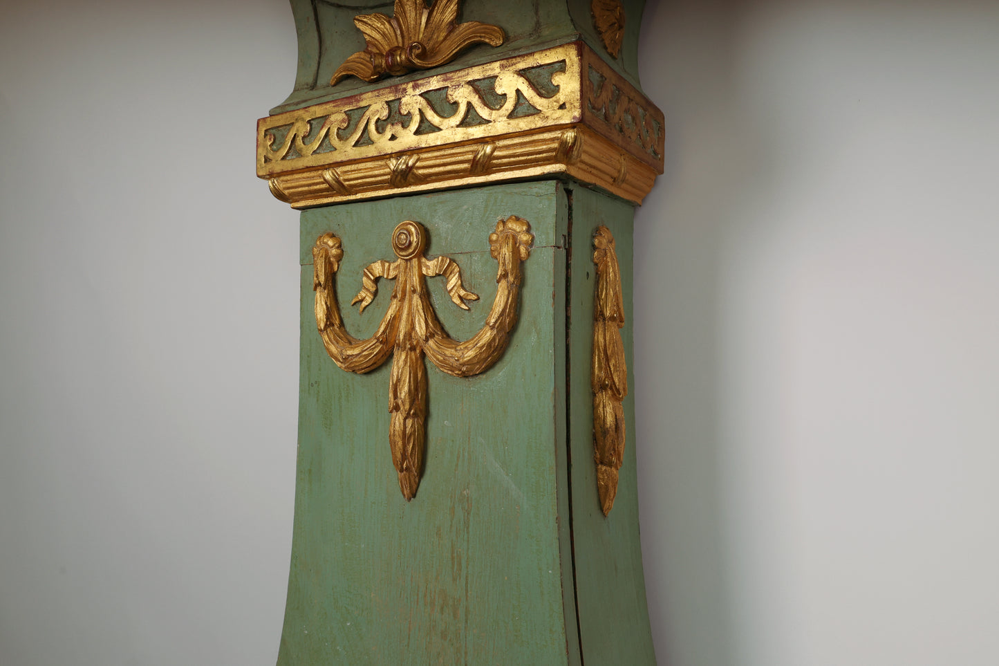 Close up of gilded detail on an 18th Century Gustavian Grandfather Clock