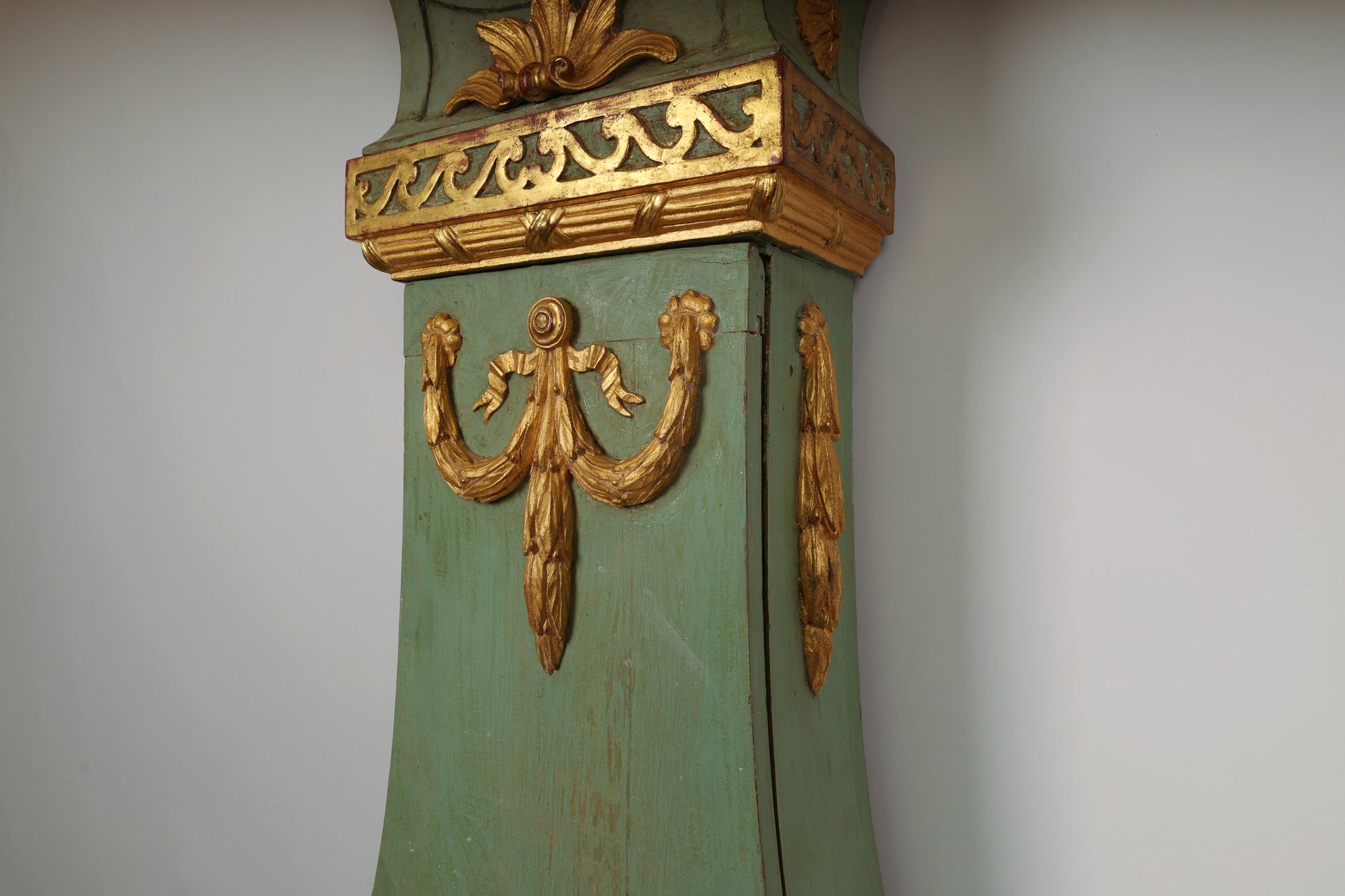 Close up of gilded detail on an 18th Century Gustavian Grandfather Clock