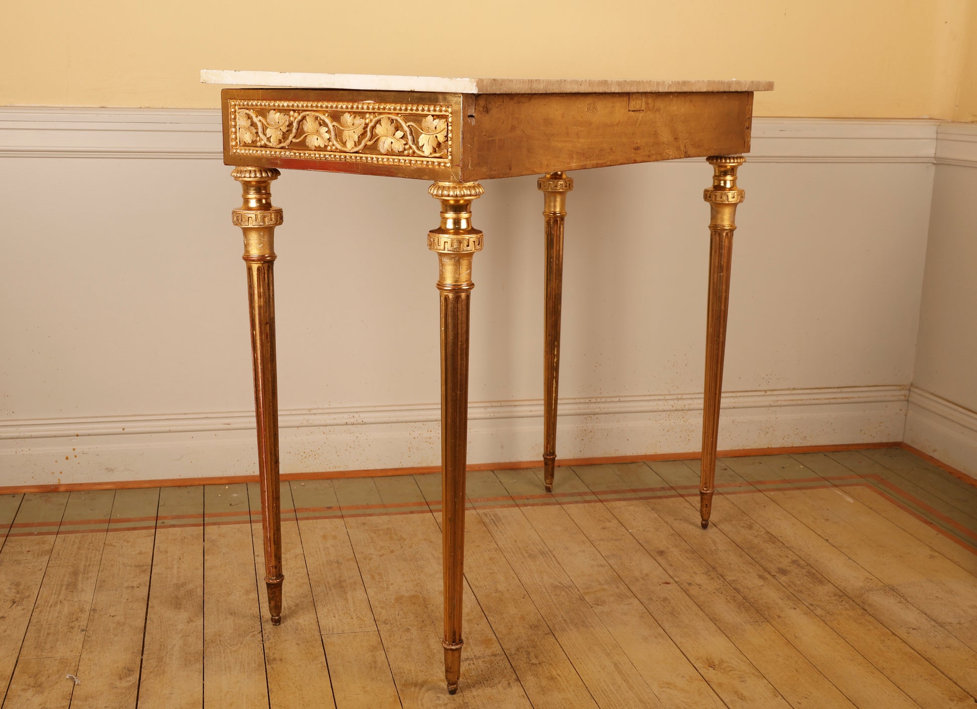 A high-quality Gustavian console table with gold leaf made by Pehr Ljung in 1770. The table features beautifully carved leaf decorations in relief and retains its original Carrara marble top.