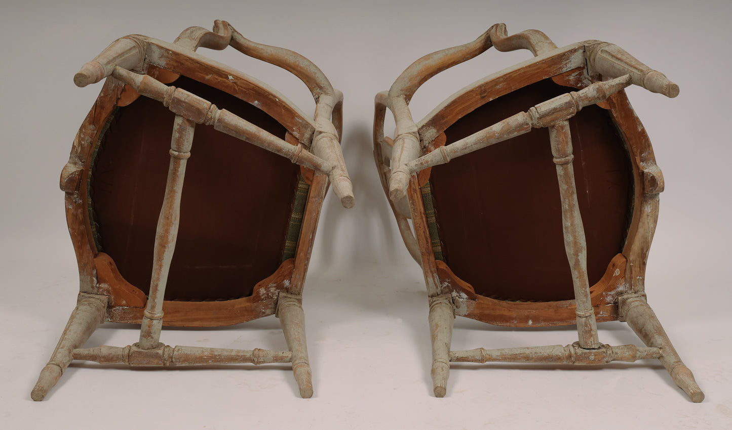 Underneath a pair of gustavian armchairs