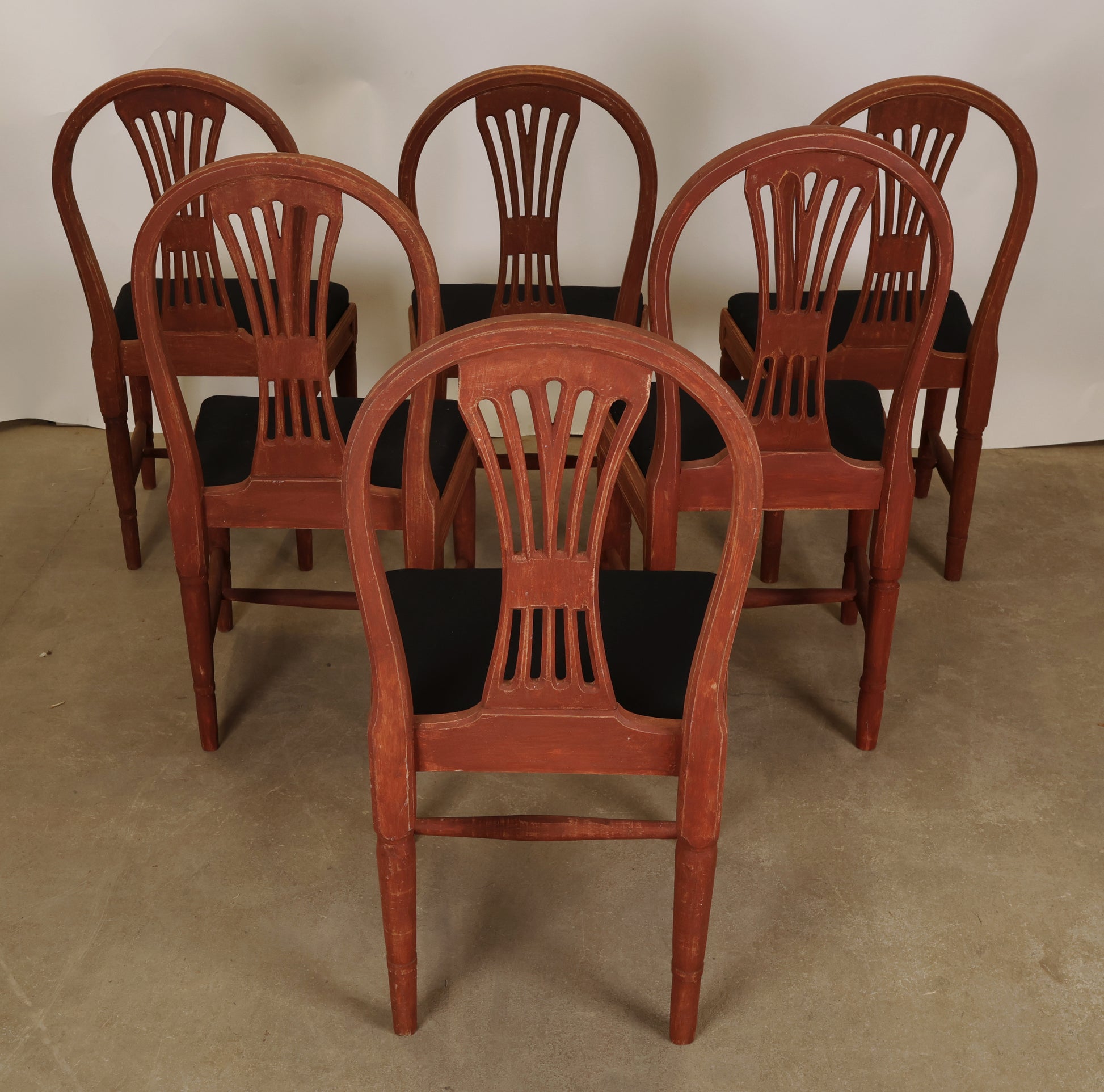 Red Gustavian chairs with black upholstery
