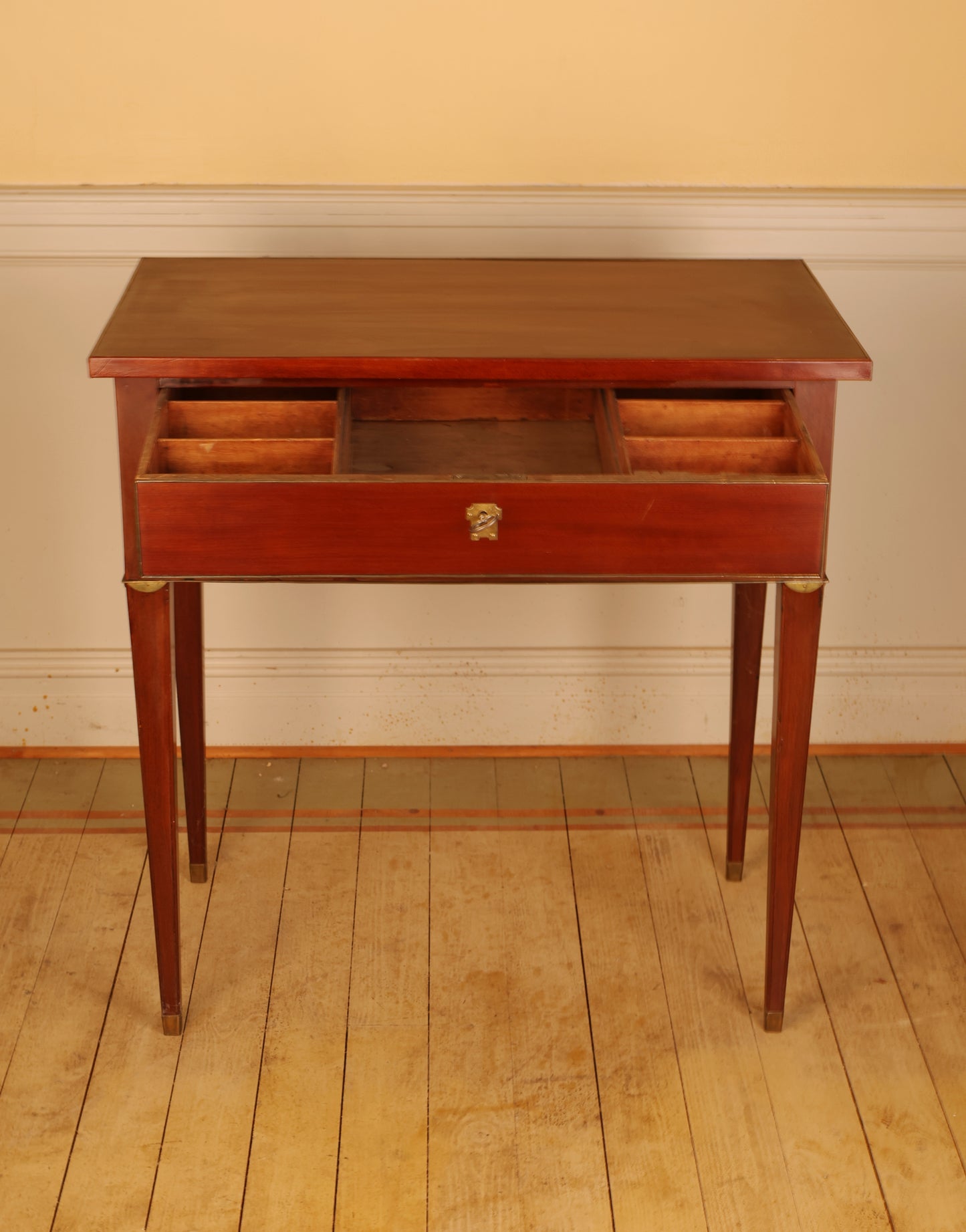 Opened drawer of a Gustavian table.