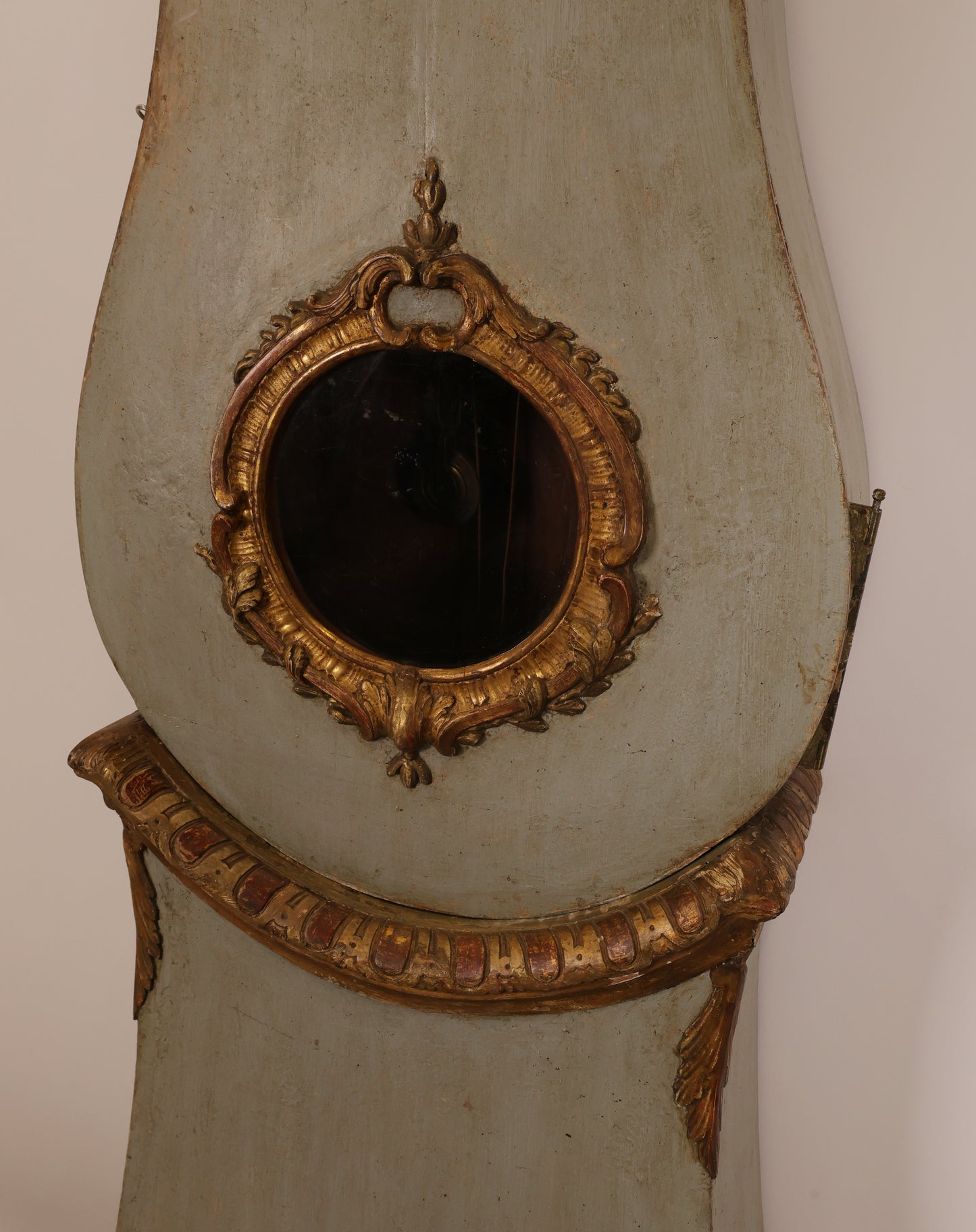 Close up of the body of an 18th Century Rococo Grandfather Clock signed Hans Wessman with rich gilded carvings in typical Rococo forms.