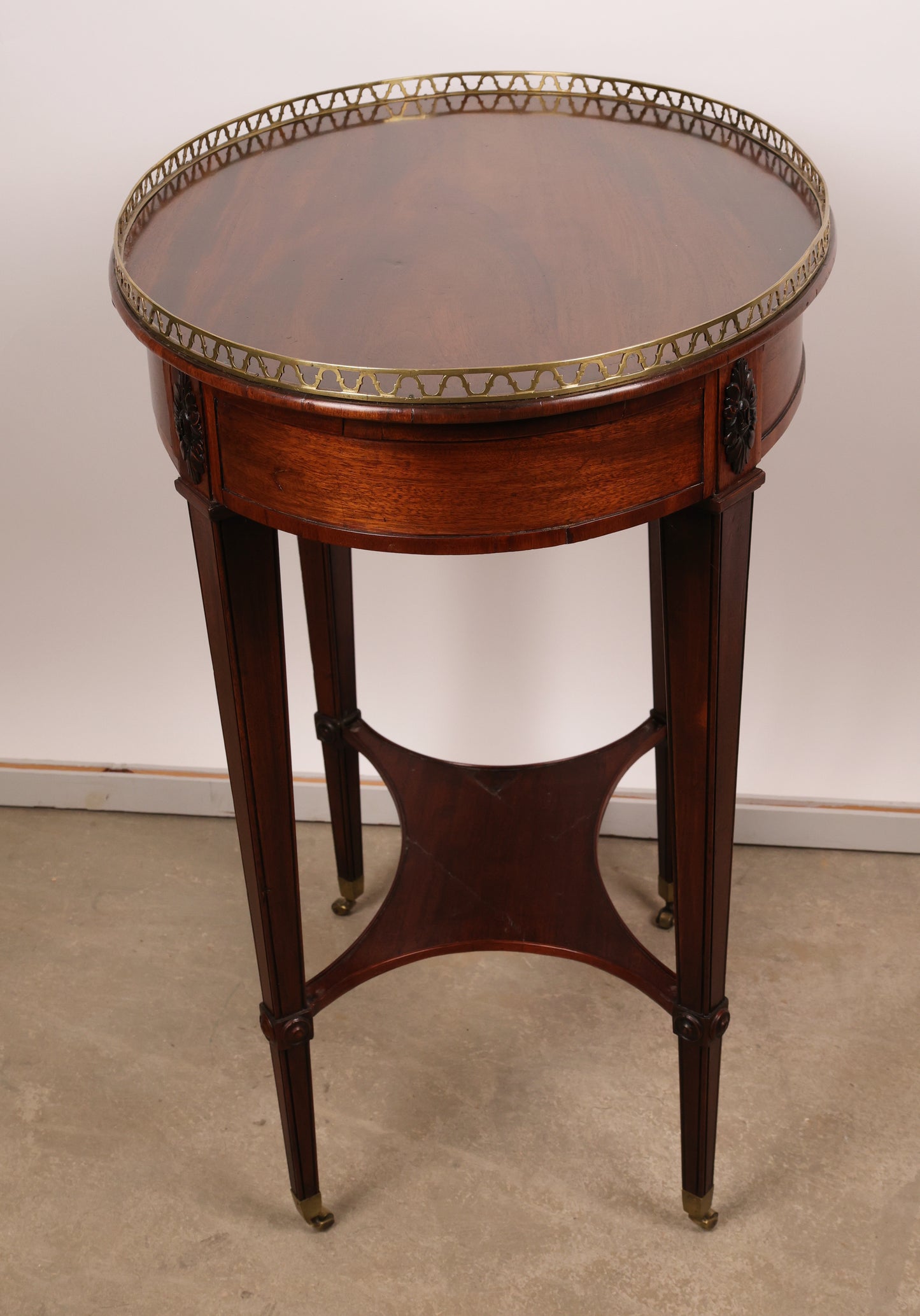 Side view of an antique high-quality Gustavian table in mahogany.