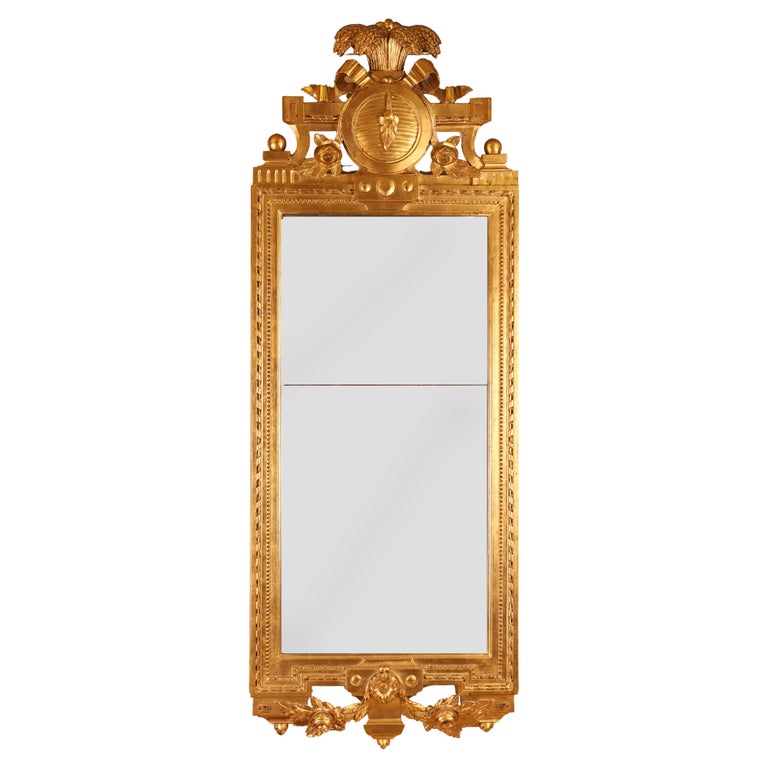 An elegant 18th century Gustavian gilded antique mirror.