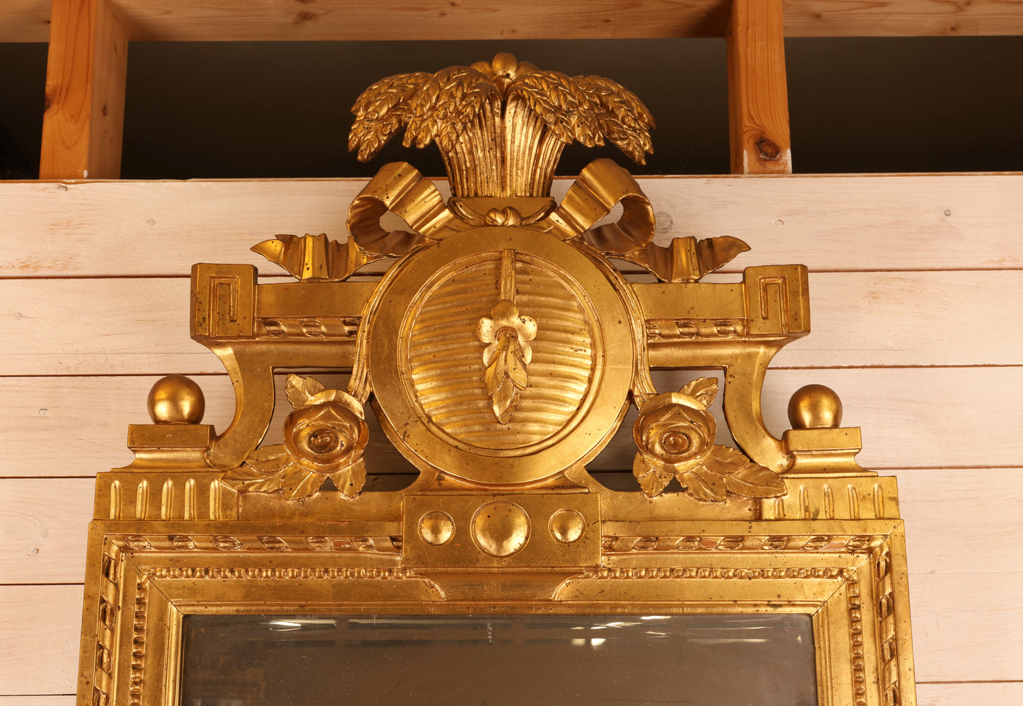 Gilded symbols on an 18th Century Gustavian Mirror.