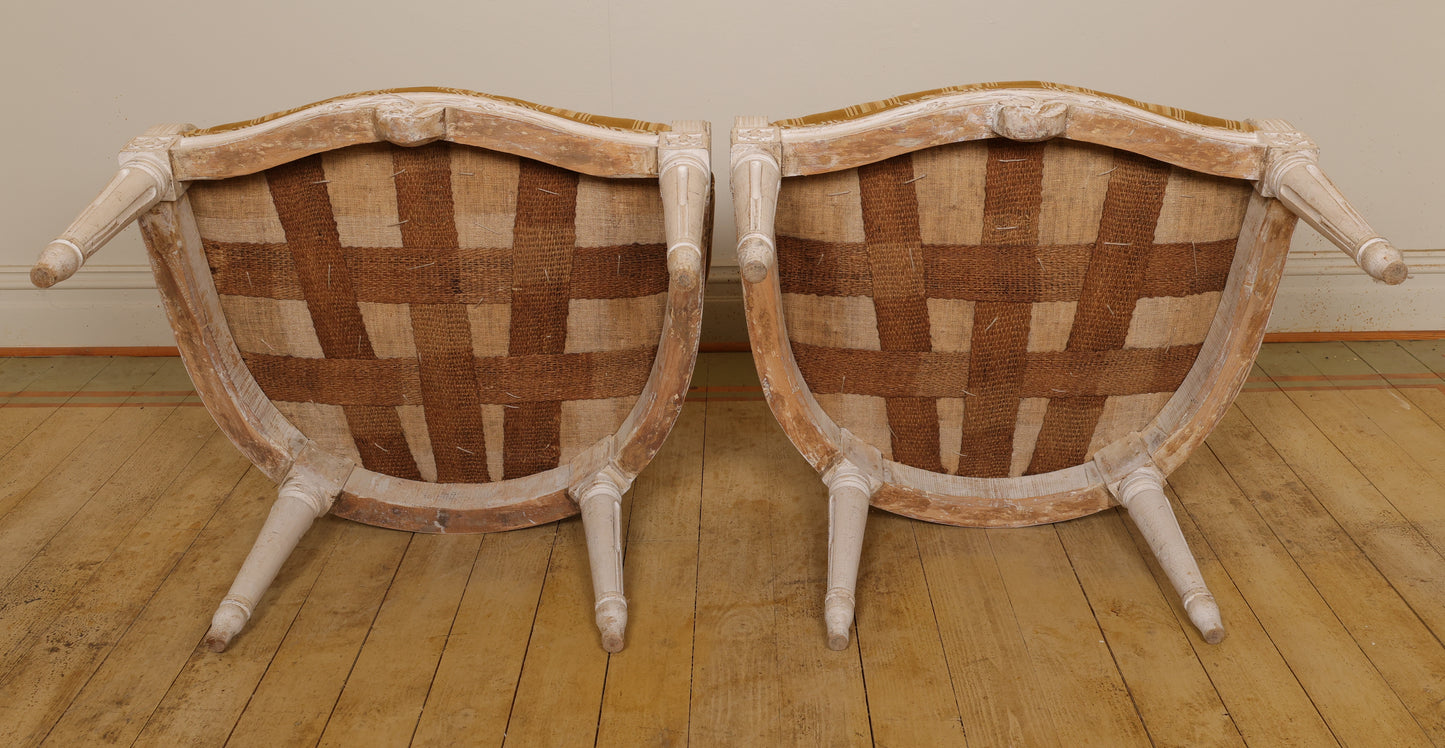 Underneath a pair of gustavian luxury armchairs.