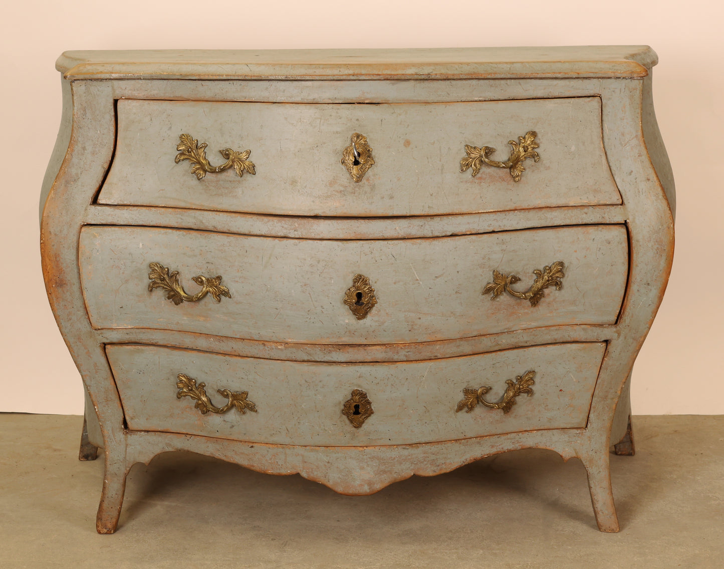 A blue rococo commode.