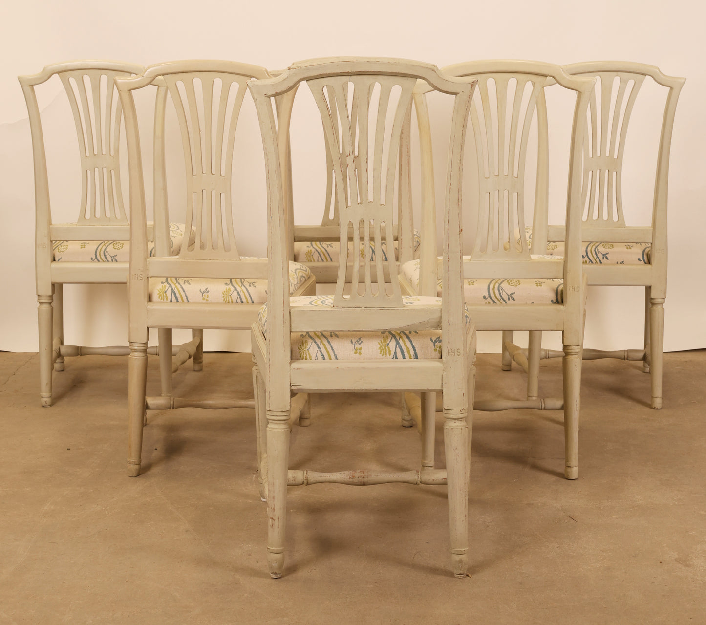 Backview of six gustavian chairs.