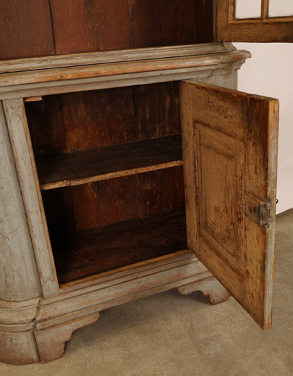 18th Century Rococo Display Cabinet with the door on the lower section opened. 