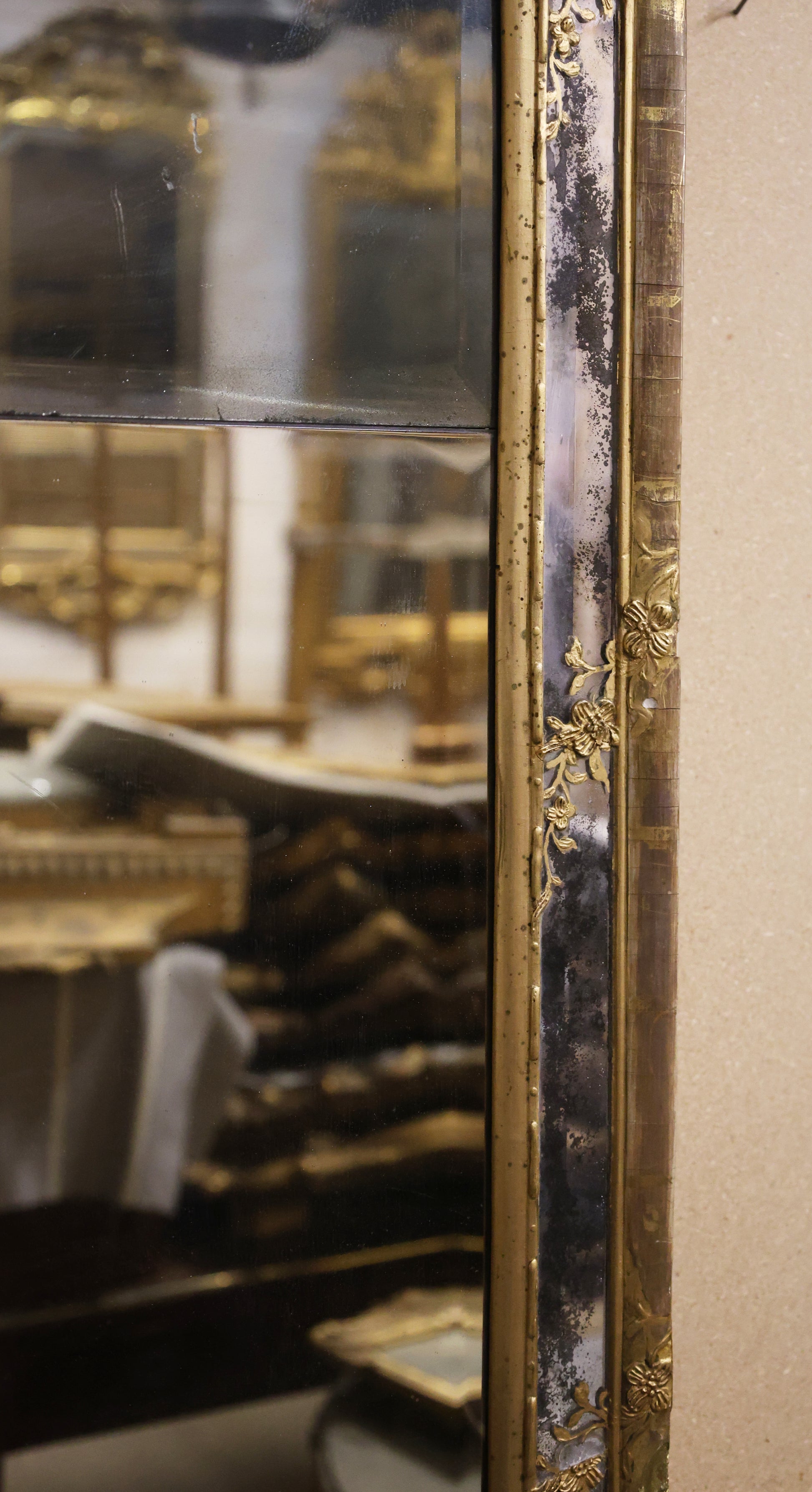 Close up of details on a gilded 18th century rococo mirror.