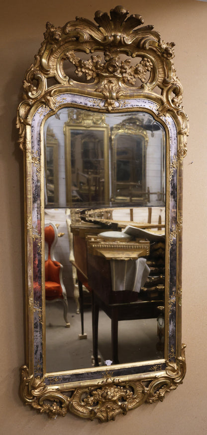 A gilded 18th century rococo mirror for sale