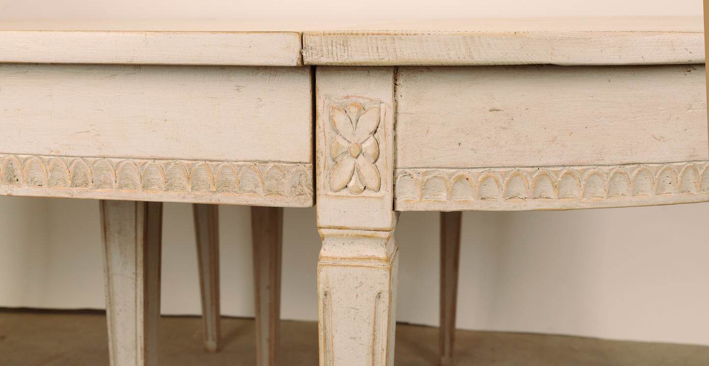 Close up of detail of 19th Century Gustavian Dining Table. Detail shows floral motif. 