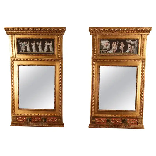 A pair of beautiful late Gustavian mirror sconces made in Stockholm around 1790. The sconces feature polychrome gouache paintings in the crowns and glass in front. The brass light arms are original. Both mirrors are fitted with mercury glass. The carvings are wood-carved, and the gilding is original that has been refreshed. White background.