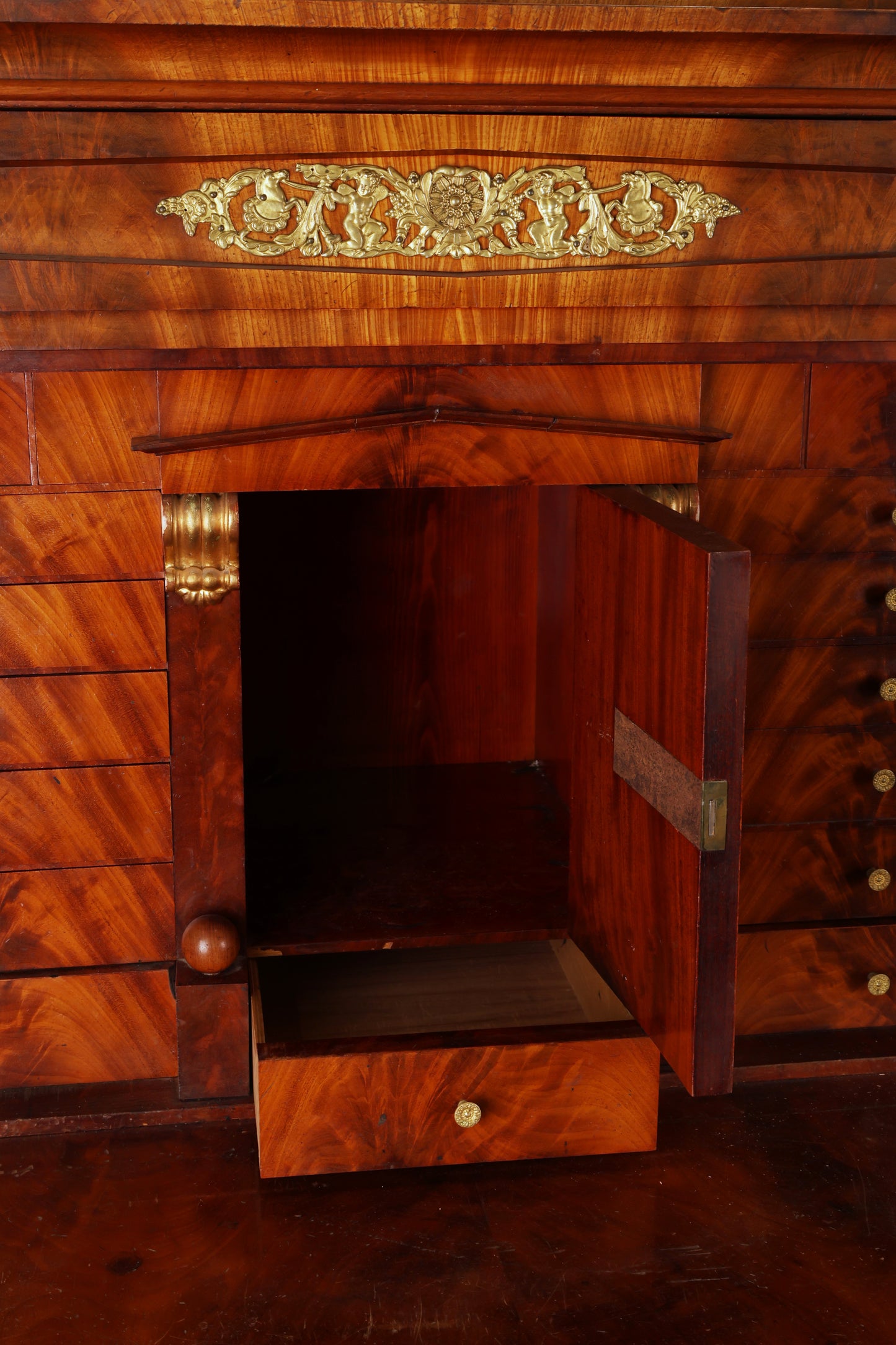 Close-up of an antique secretary from the Empire epoch.